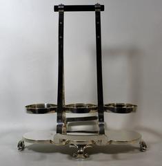 Tantalus Wine Cradle by Hukin & Heath in the Christopher Dresser Style
