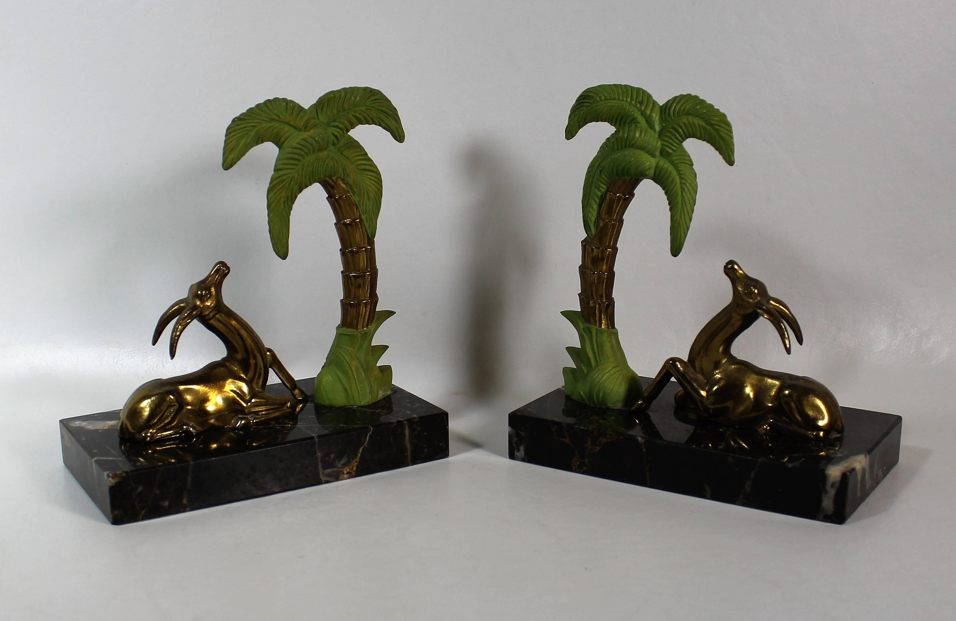 French Art Deco spelter antelope bookends with marble bases.