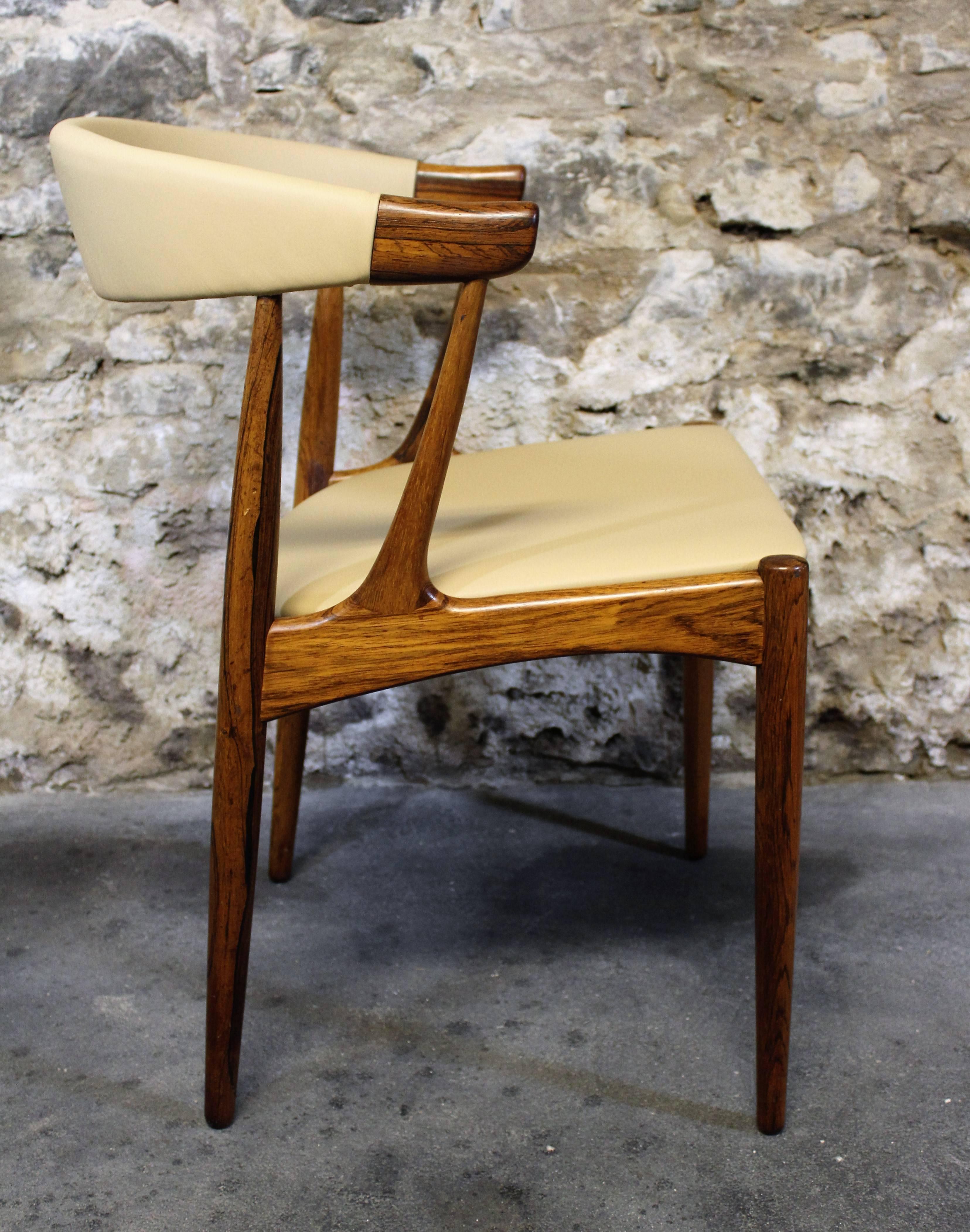 Four Johannes Andersen Danish Modern rosewood and leather dining chairs Model BA113.

Mid-Century Modern / Scandinavian Modern