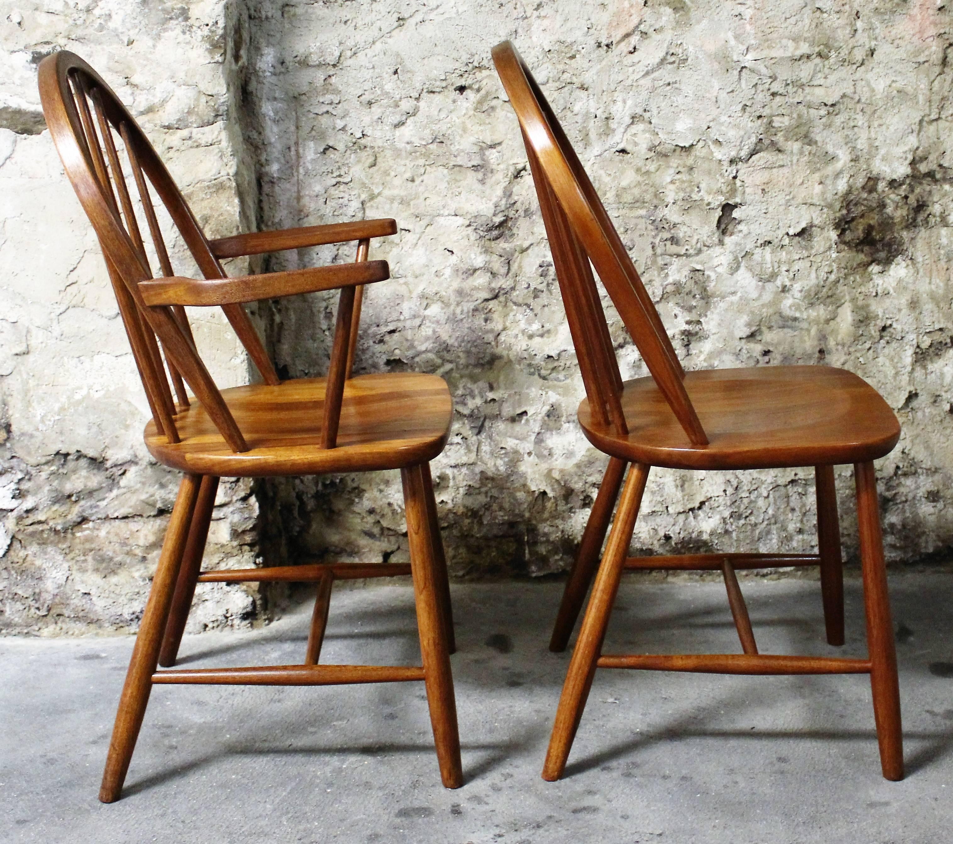 Set of four hoop and stick back Danish teak dining chairs designed by Erik Ole Jorgensen for Tarm Stole. Two captains and two armless chairs.