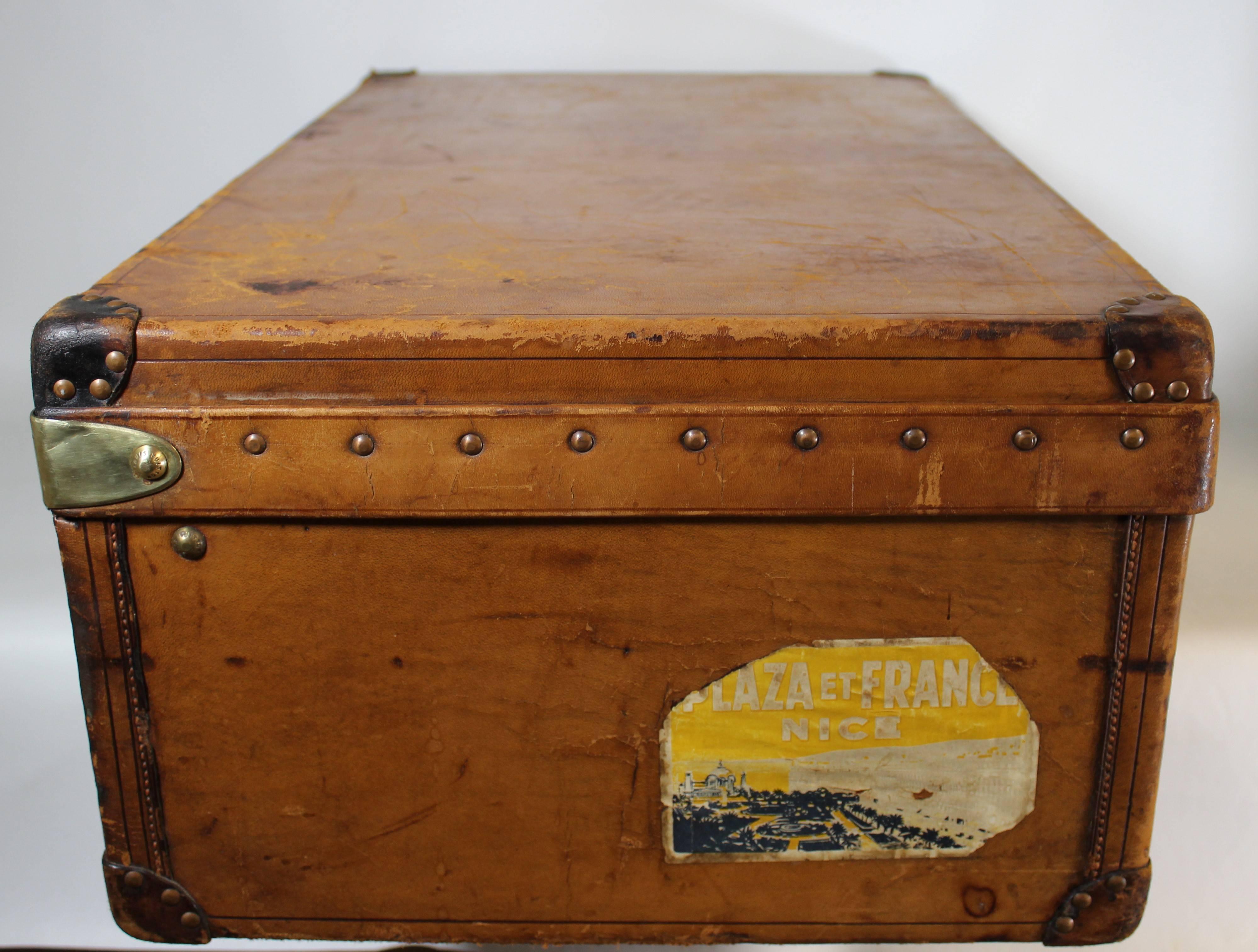 This authentic Louis Vuitton cabin trunk from the turn of the century is done in calf's leather which has developed a beautiful warm and weathered patina over time. What's remarkable about this piece is the fact that it comes in completely original,