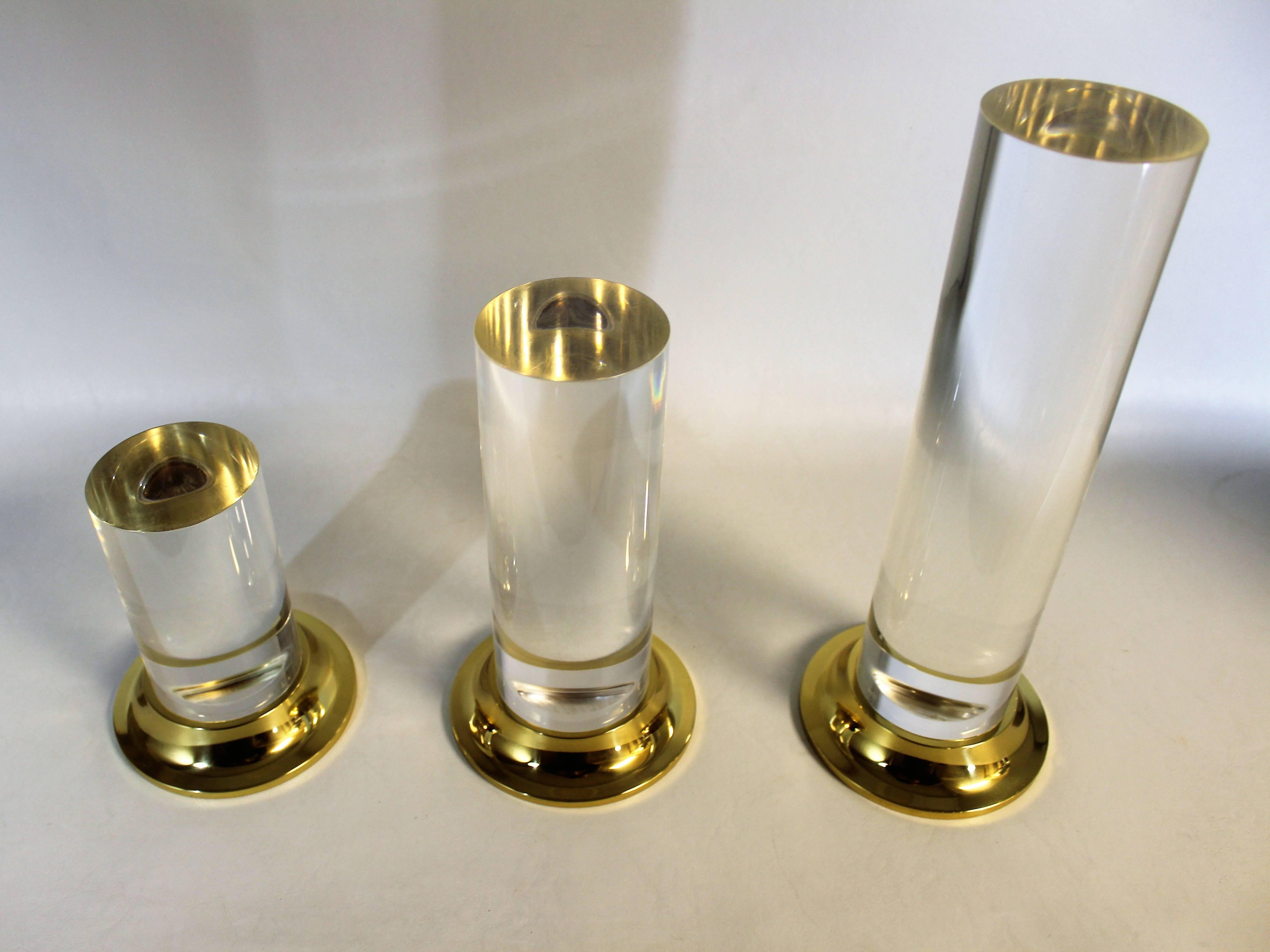 Set of three Lucite and brass candlesticks, Mid-Century Modern.