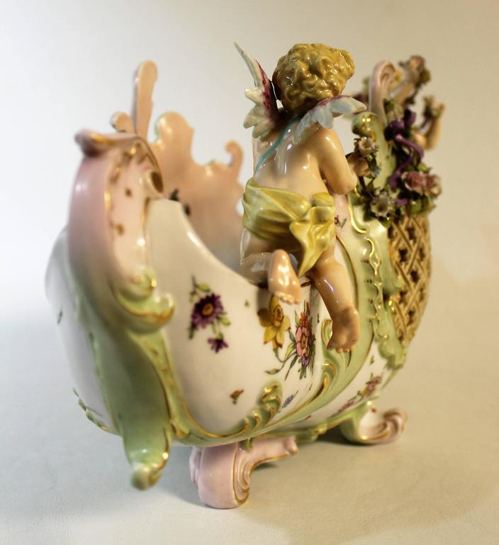 E and A Muller 'Corona' Porcelain Figural Cherub Jardinière or