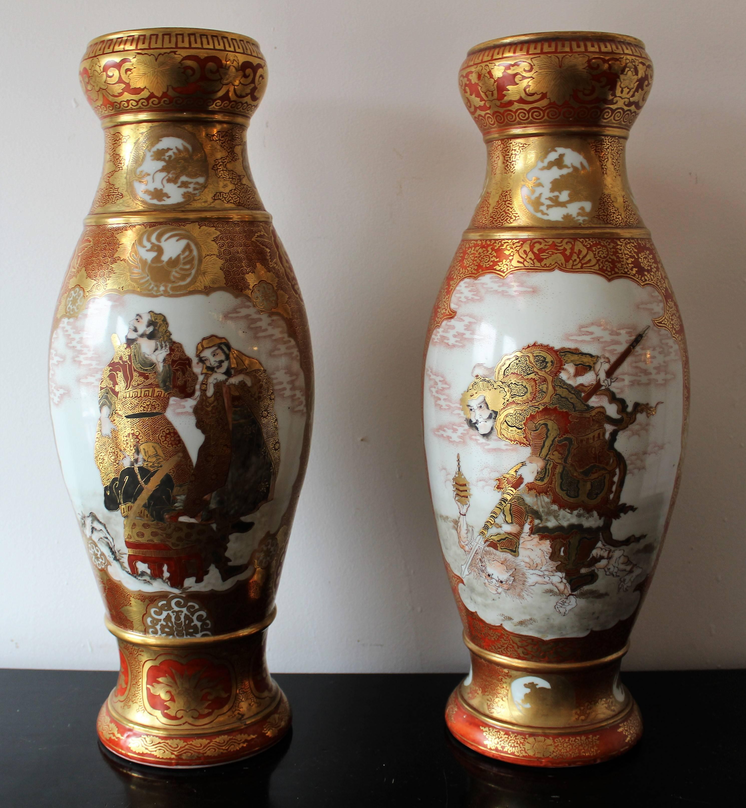 Pair of Japanese Meiji period Kutani porcelain vase's finely decorated in over glaze rust-red and polychrome enamels with scrolling gilt designs of foliate, dragons, animals and mythical creatures throughout. Each vase features two cartouches with