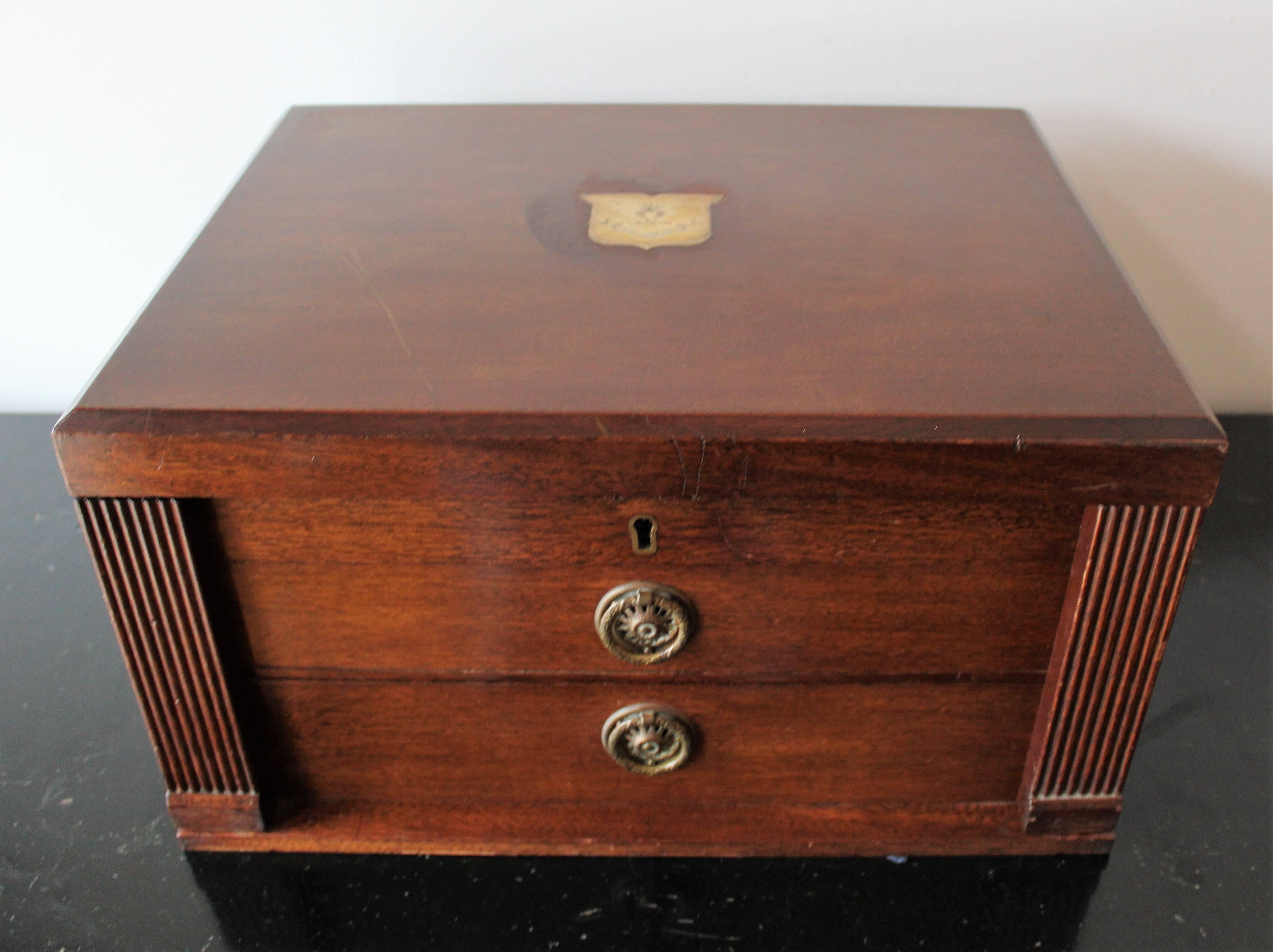 Walker & Hall  of Sheffield, England sterling silverware set with family crest marks and box.  Each piece of silverware bears the family crest.  The top of the box contains an inset plaque also bearing the family crest as well as the latin
