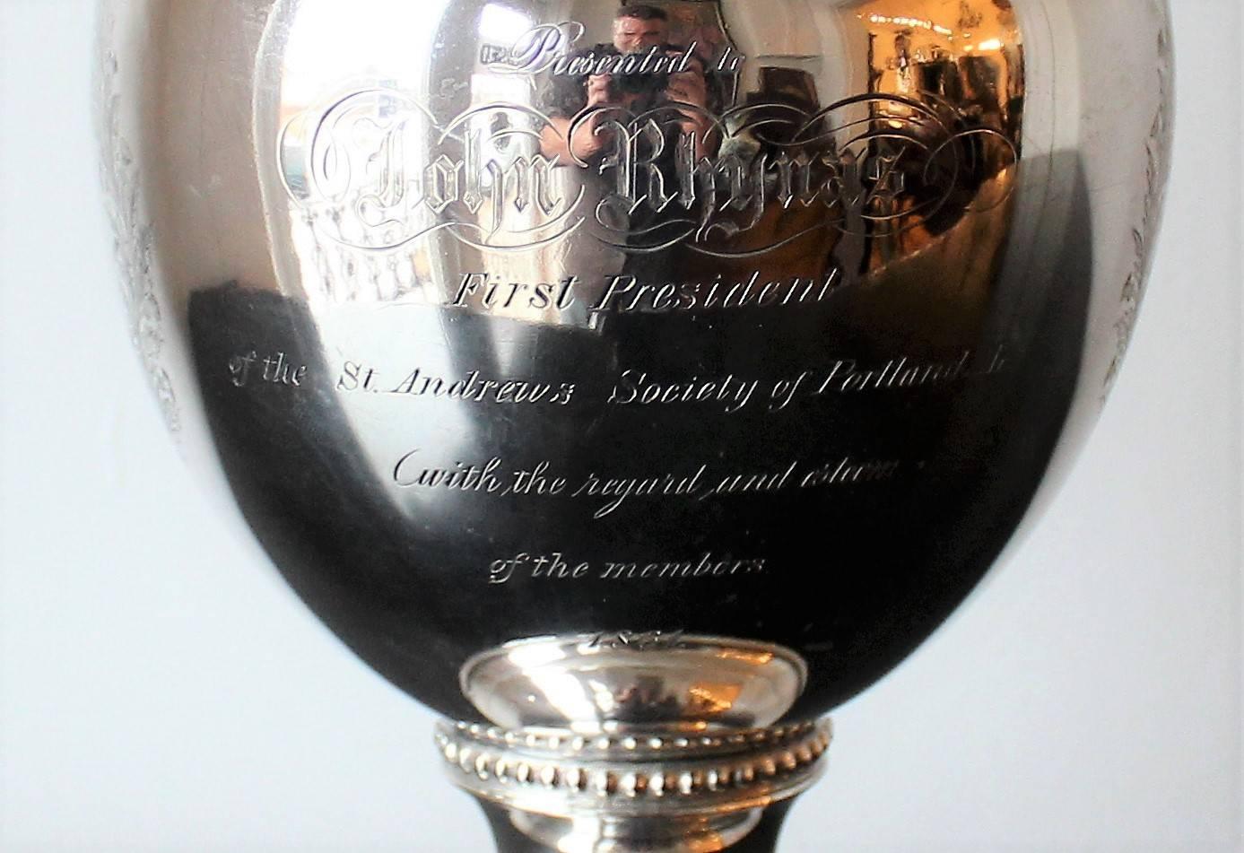 19th century American coin silver presentation pitcher made by Newell Harding & Co silversmiths of Boston Massachusetts and presented to the first president of the St. Andrews Society of Portland in 1861. It bears an engraving of the Scottish Royal