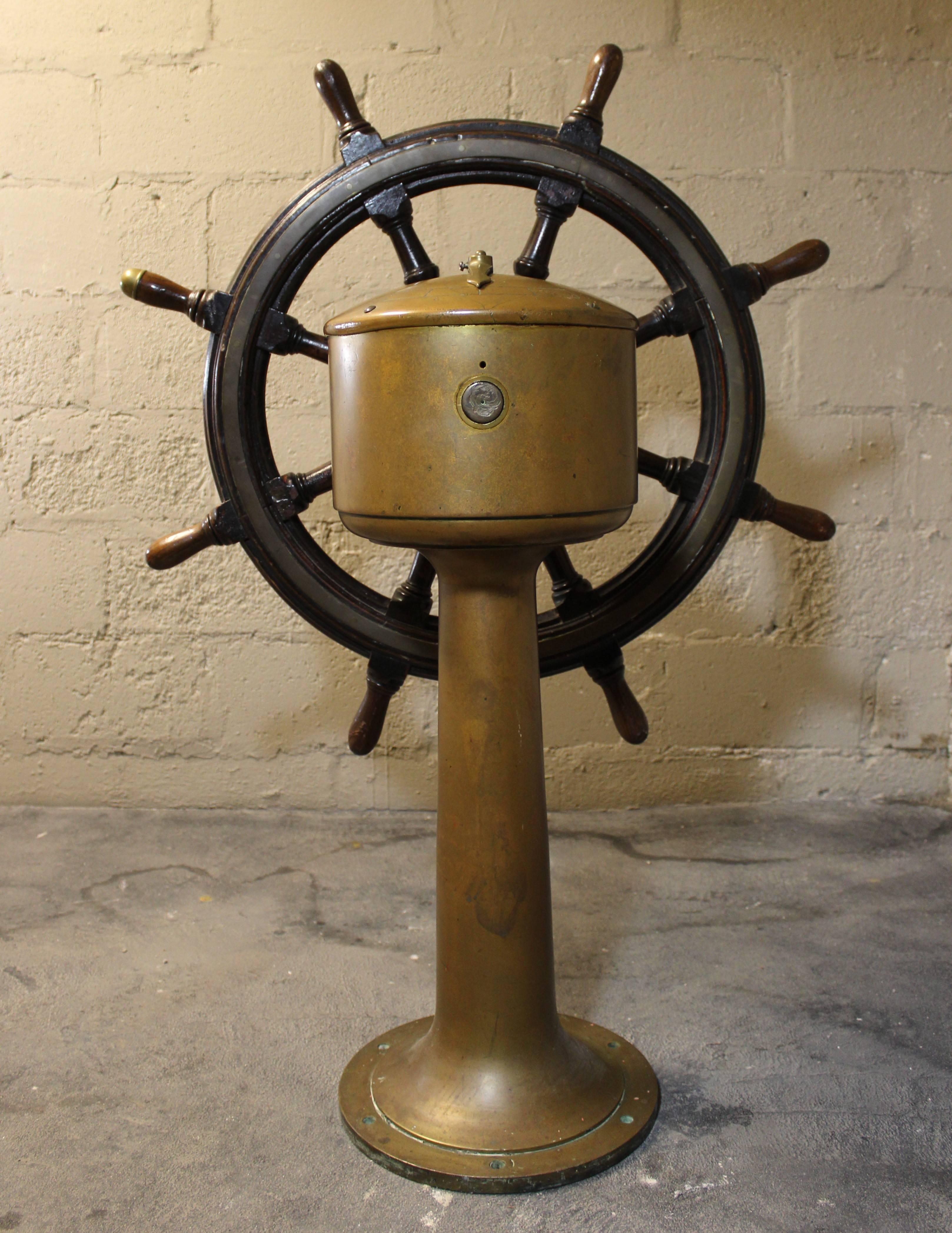 English ship's wheel and steering pedestal made by Robert Roger & Co. Stockton-On-Tees.