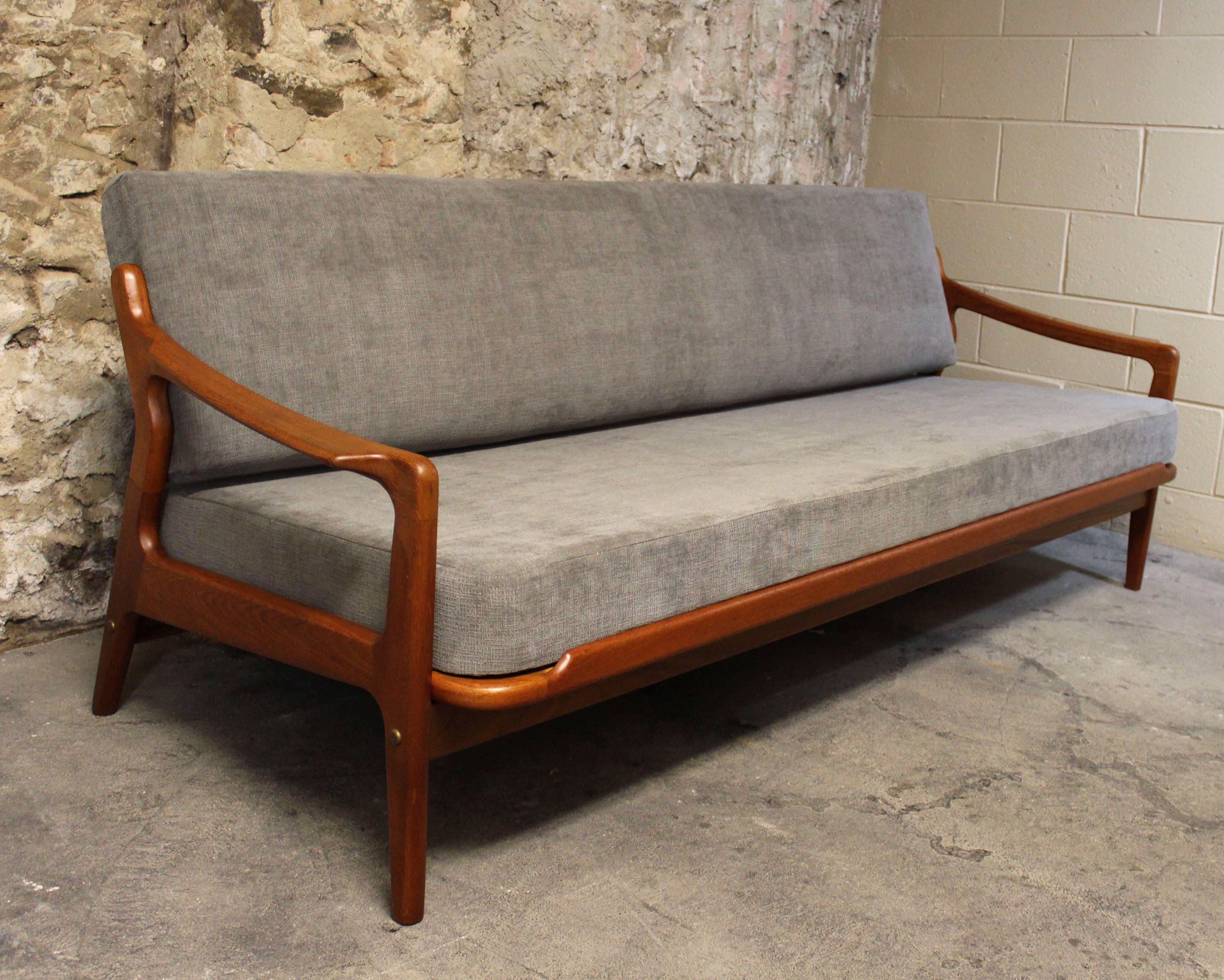 Arne Wahl Iversen Danish teak daybed and sofa
This three-seat Mid-Century Modern sofa by Arne Wahl Iversen was produced in Denmark in the 1960s. This piece is made from teak and can be simply used as a sofa, or it easily rolls out for a comfortable