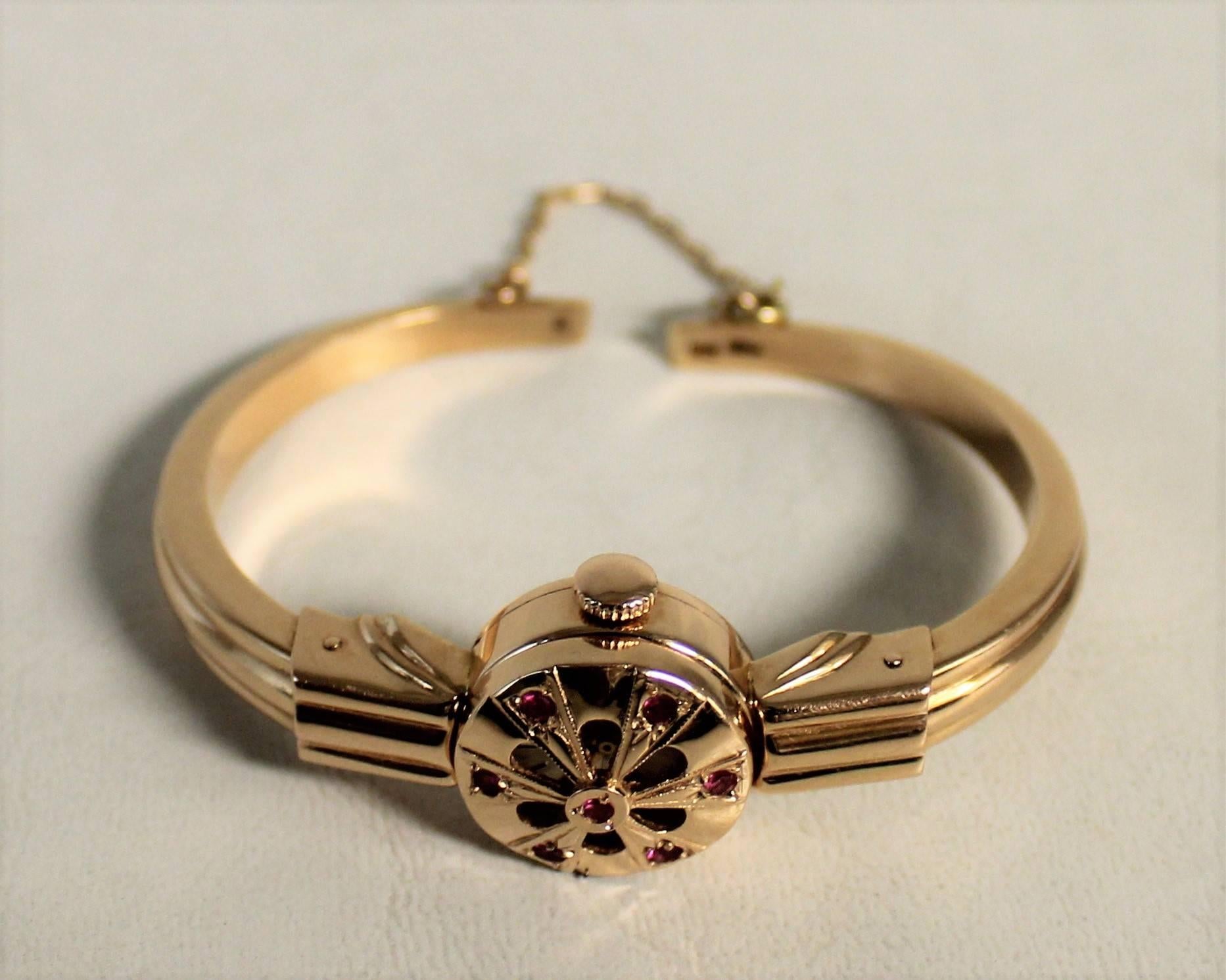 14-carat gold Russian Haupu ladies watch with rubies and hinged cover. Weight: 20.7 grams.
