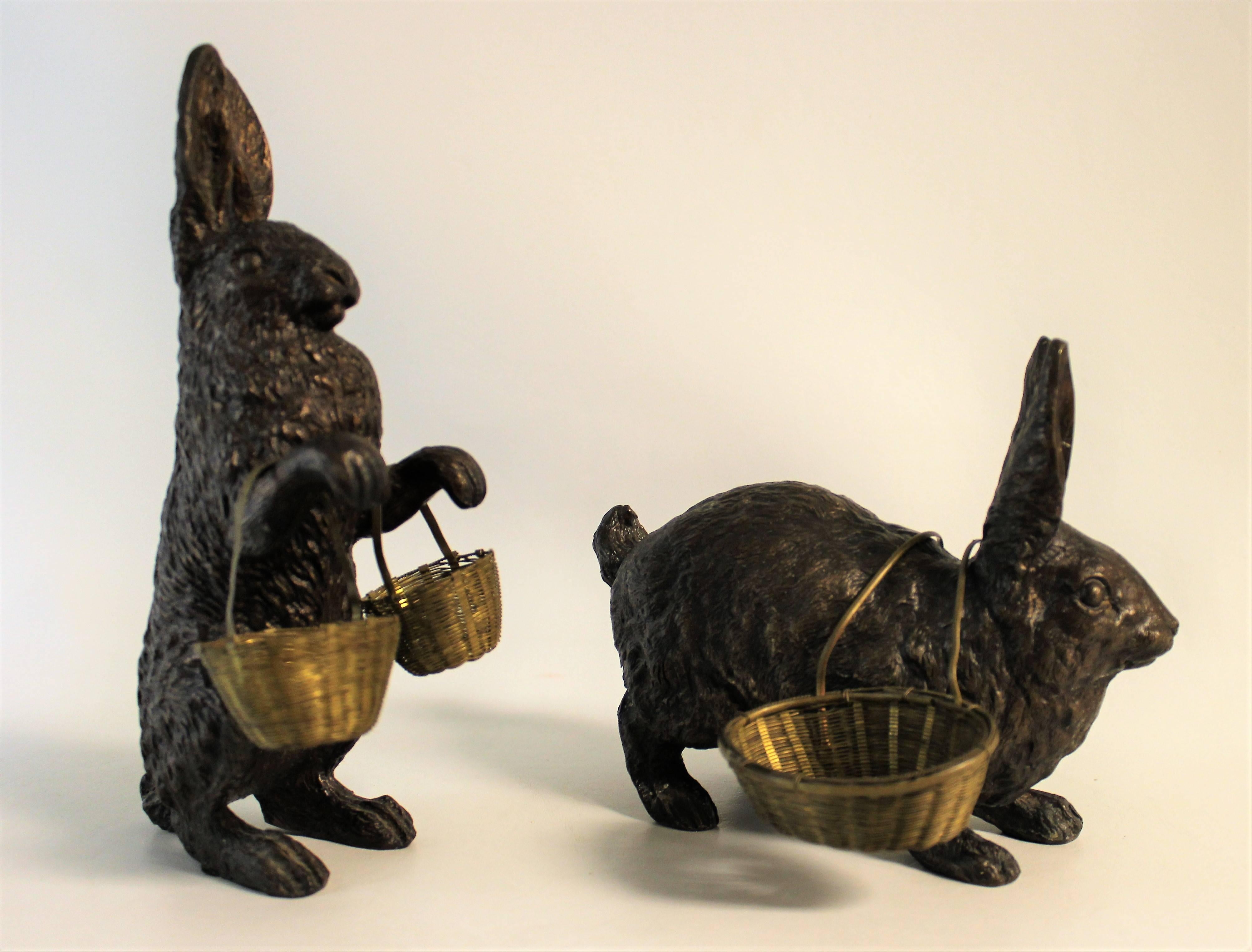 Pair of Edwardian bronze rabbit sculptures with baskets.