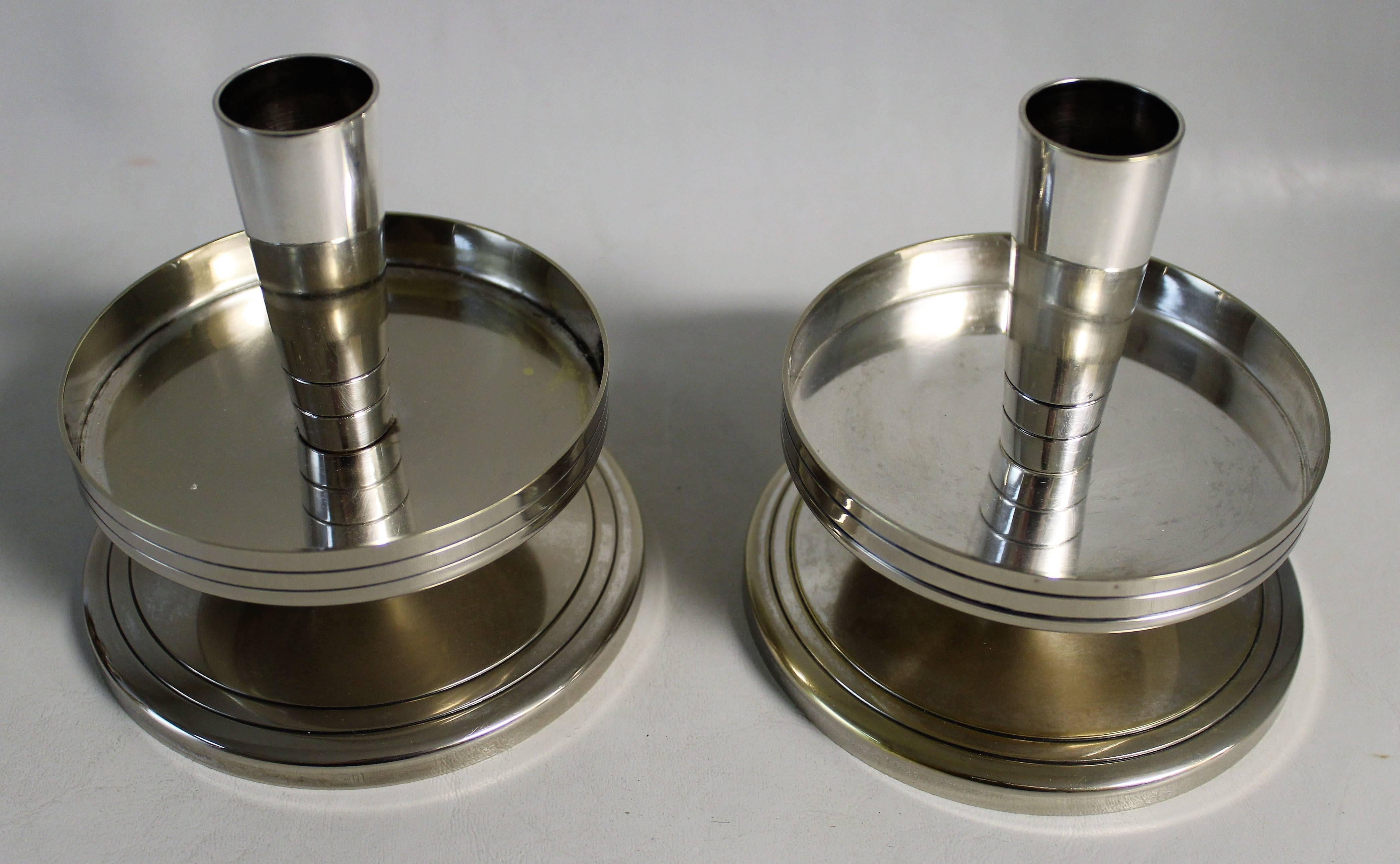 Pair of Tommi Parzinger for Mueck-Cary silver plate candlesticks.