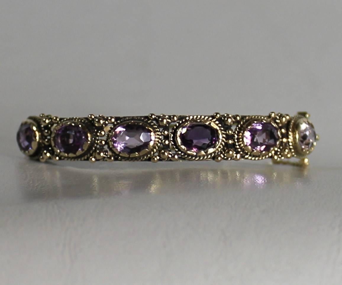 Ladies 14-carat yellow gold bracelet containing ten carats of faceted natural amethysts. Measures: Weight 24 grams.