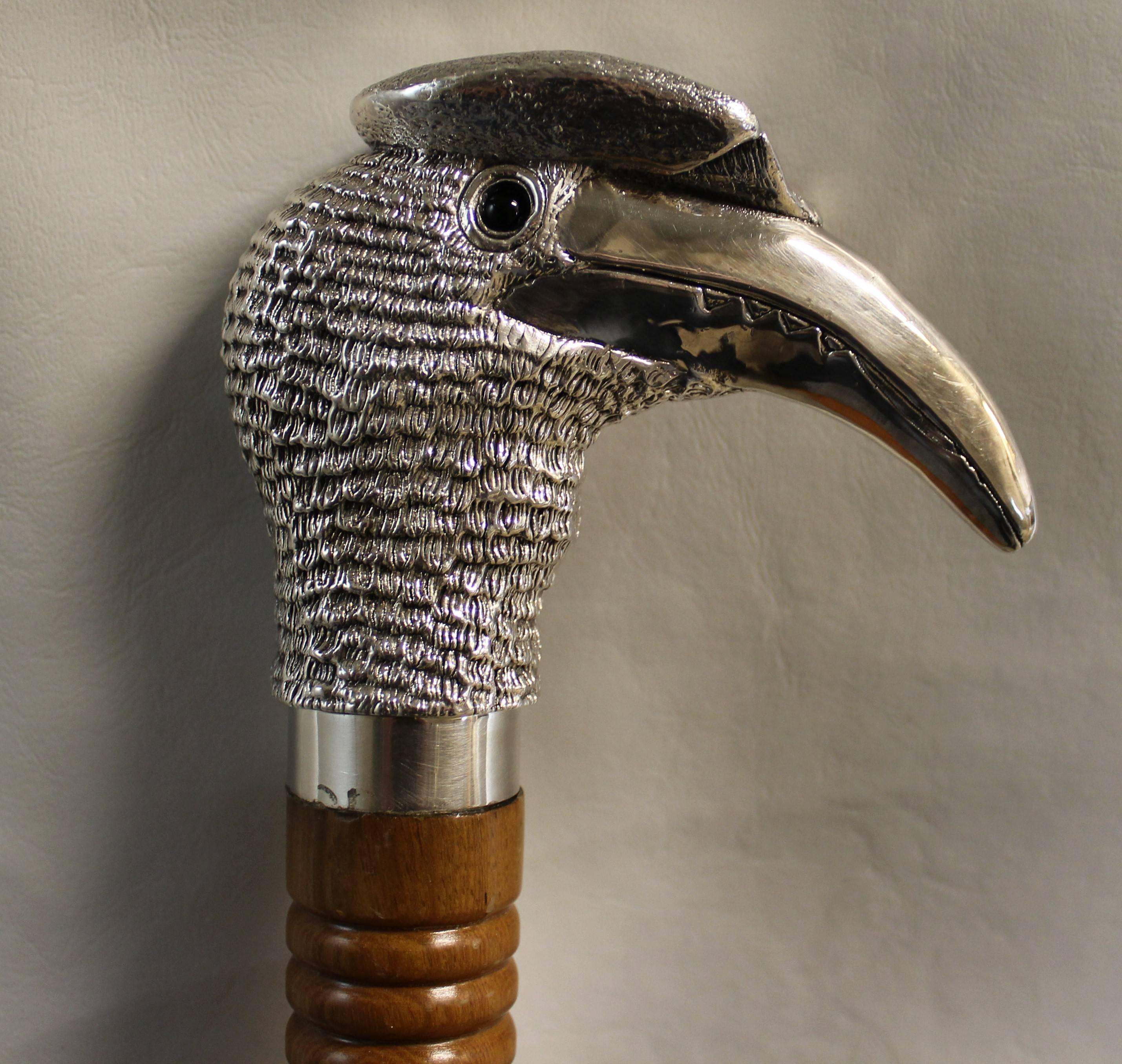 Magnificent sterling silver mounted walking stick with a handle beautifully modelled as the head of a hornbill by Comyns of London. Both tip and collar have London hallmarks for 1898 which include William Comyns distictive 'WC' mark.