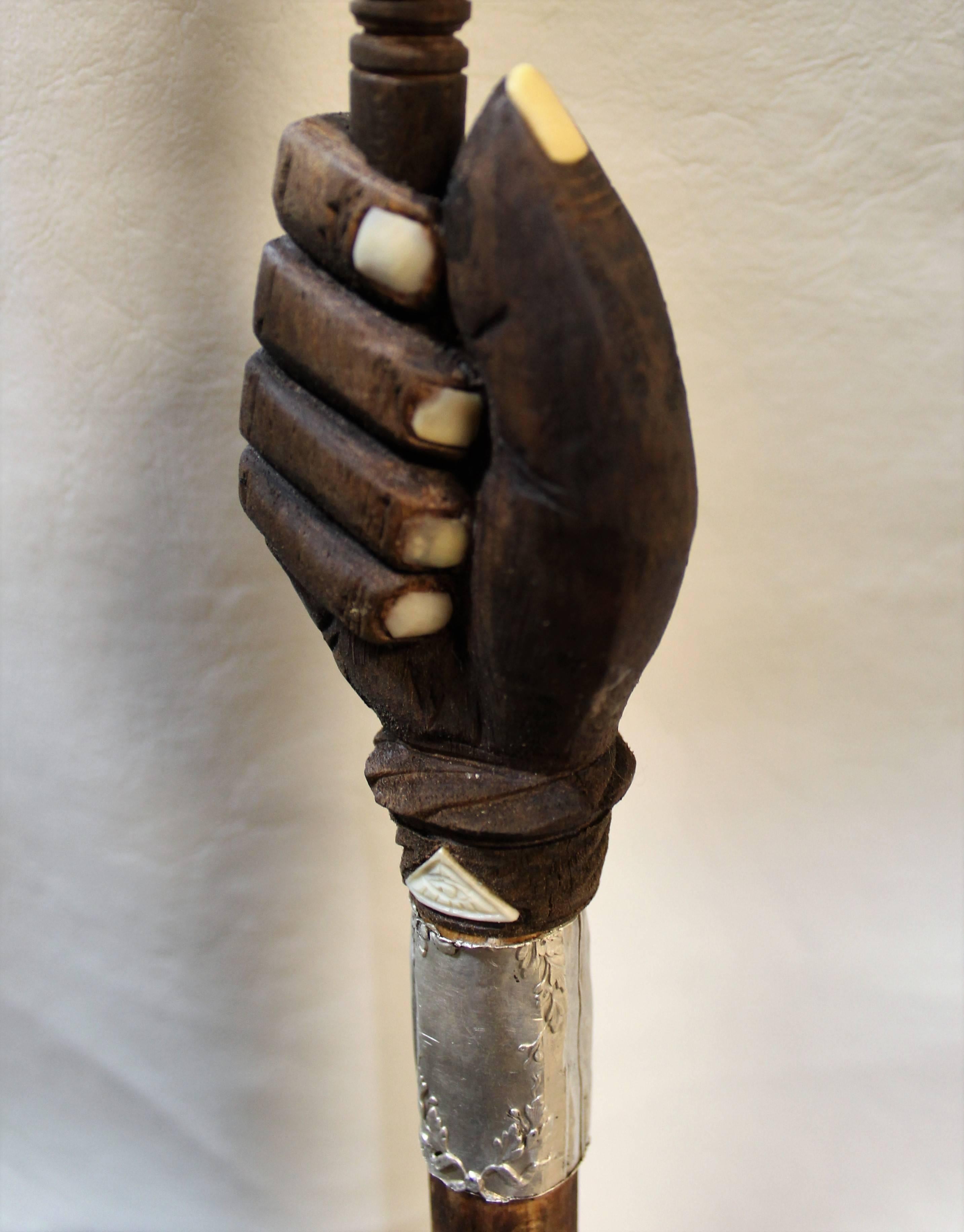 19th century German masons cane or walking stick made of wood, silver and bone. The handle is a gavel which detaches from the rest of the cane.