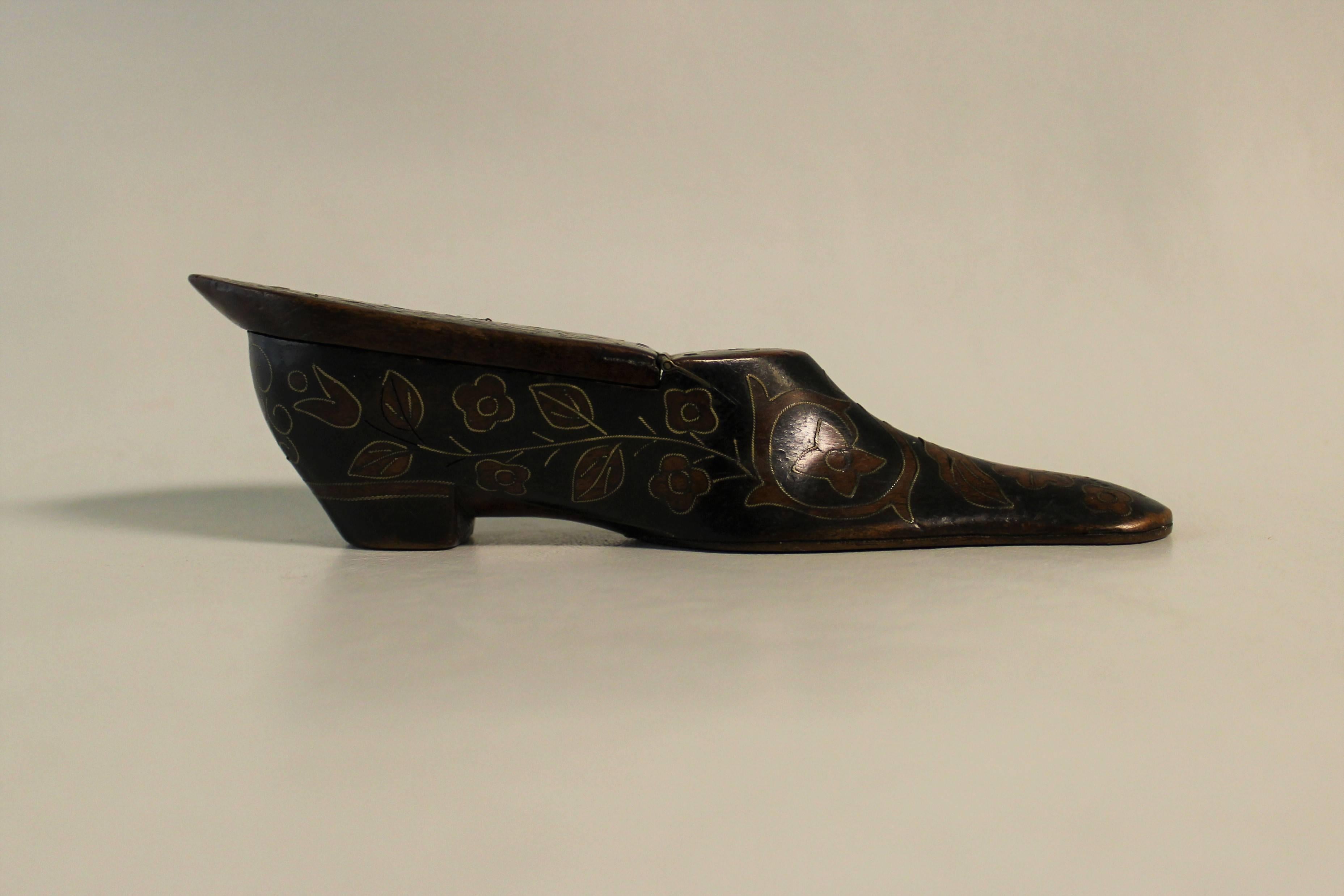 In the 19th century, boots and shoes were symbols of good luck. So, it was only natural that trinkets and personal objects should take the form of footwear. This snuffbox, dating to the Georgian era is an excellent example of that phenomenon. The