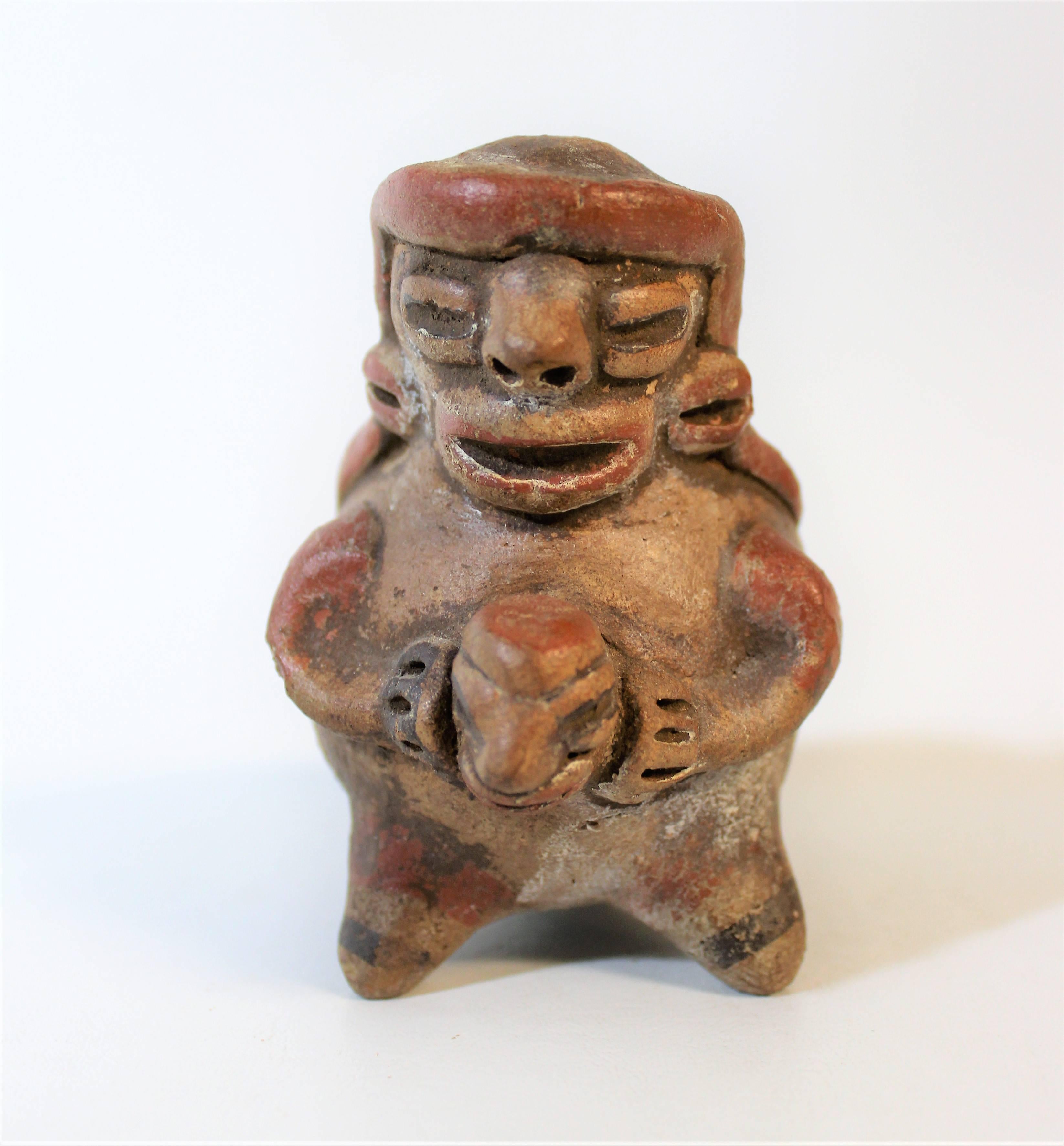 A refined Pre-Columbian artist who was deeply engrossed in portraying the divine simplicity of sculpture and line undoubtedly created this exquisite Ocarina. The artist has paid special attention to create a beautiful polychrome design on its body.