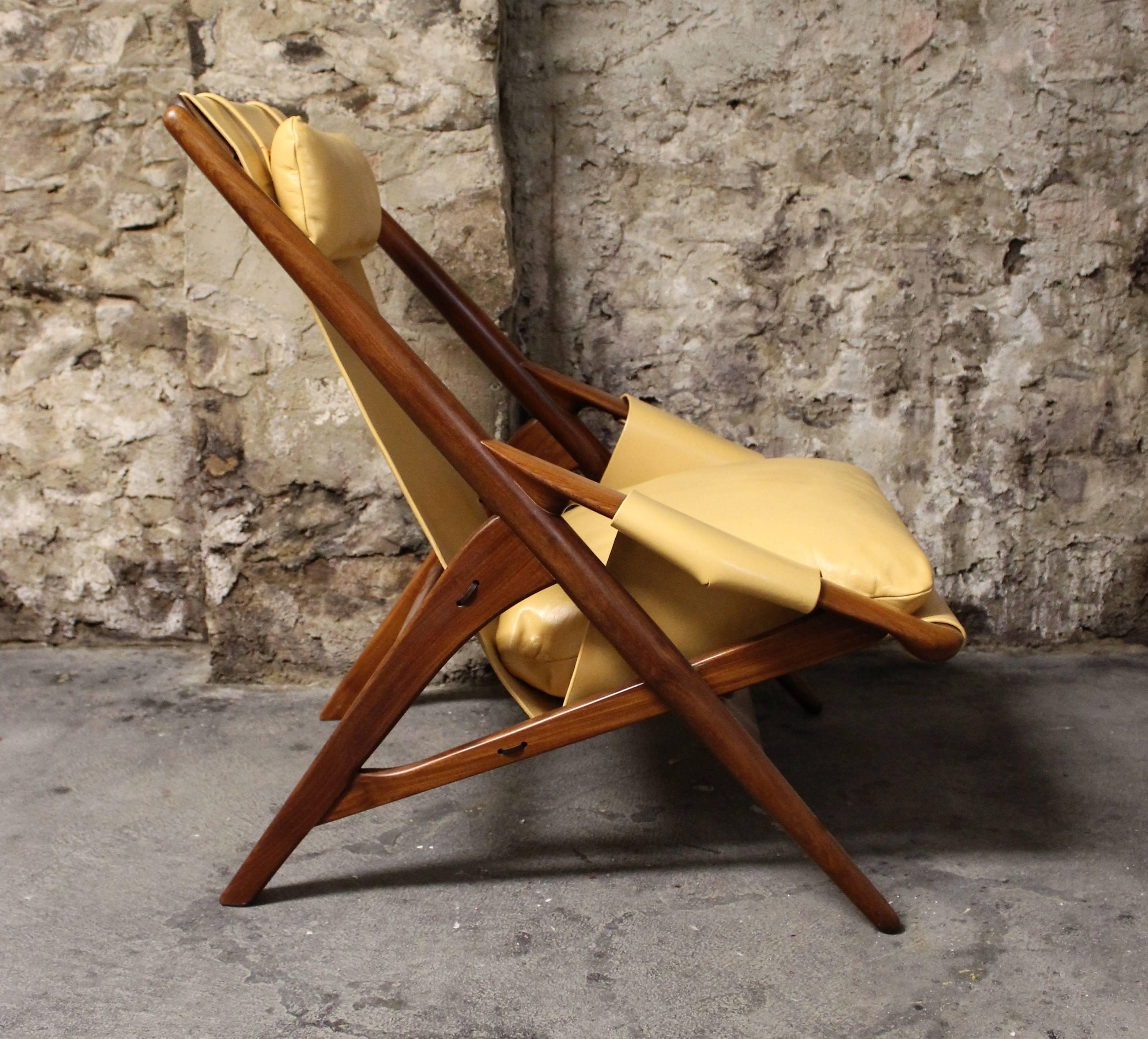 Gorgeous Mid-Century Modern sling chair by Italian designer W.D. Andersag. The frame is made of afromosia wood and features stunning grains and warm rich hues. The high quality Italian leather is original and has been completely restored and re-dyed.