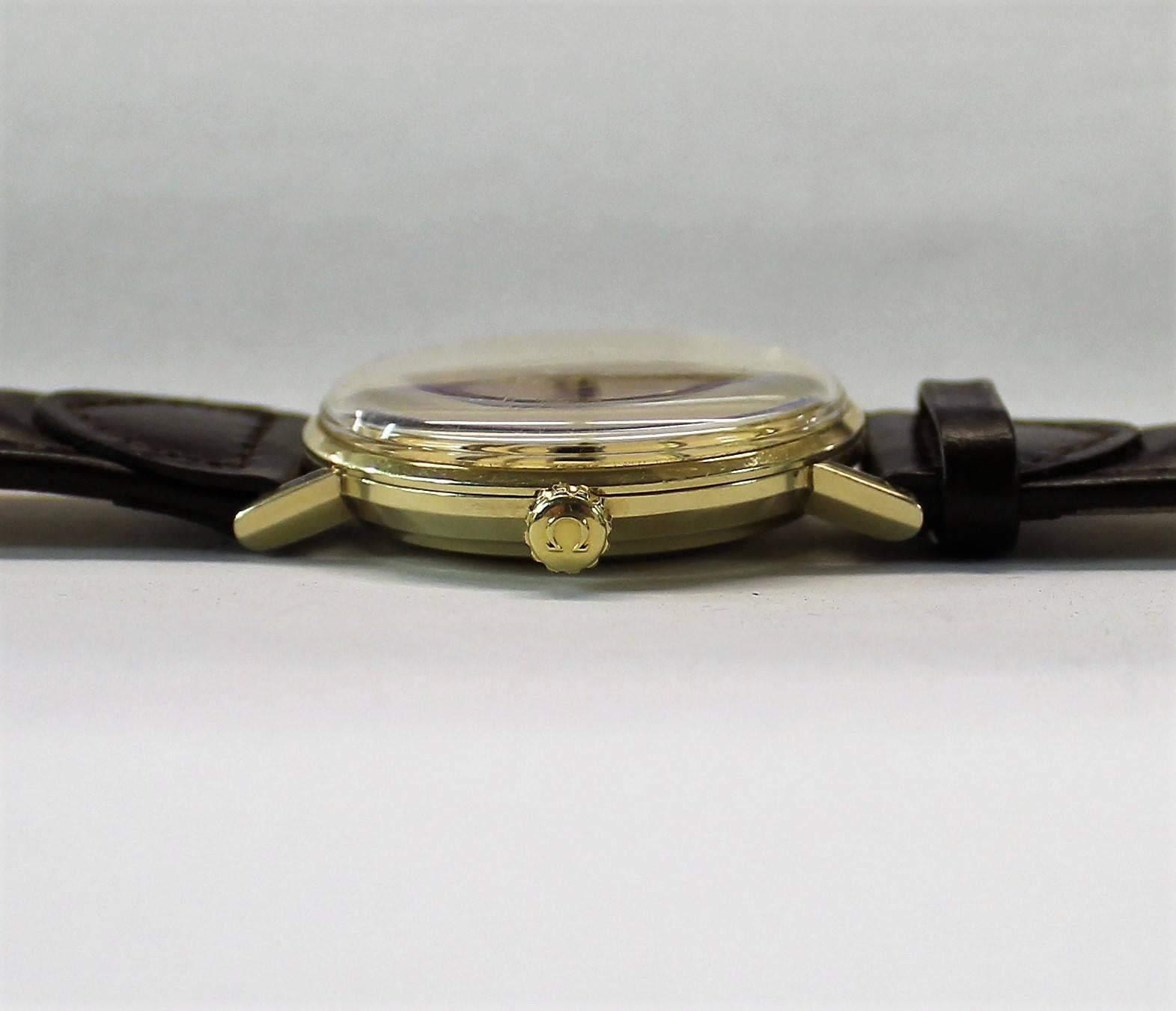 14-karat gold Omega Seamaster De Ville automatic wristwatch with quick set date.