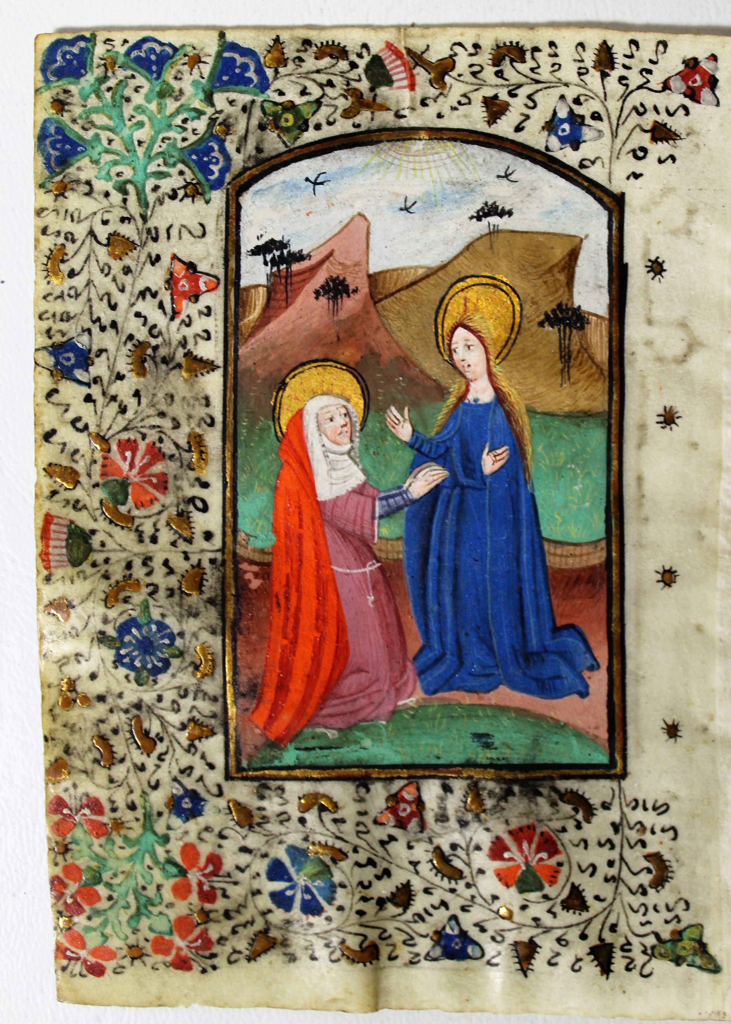 Exquisite illuminated manuscript and portrait miniature from a 15th century Dutch Book of Hours. This bifolium opens to feature a fantastic miniature painting of the Virgin Mary in an arched compartment. The text opens up a morning prayer known as