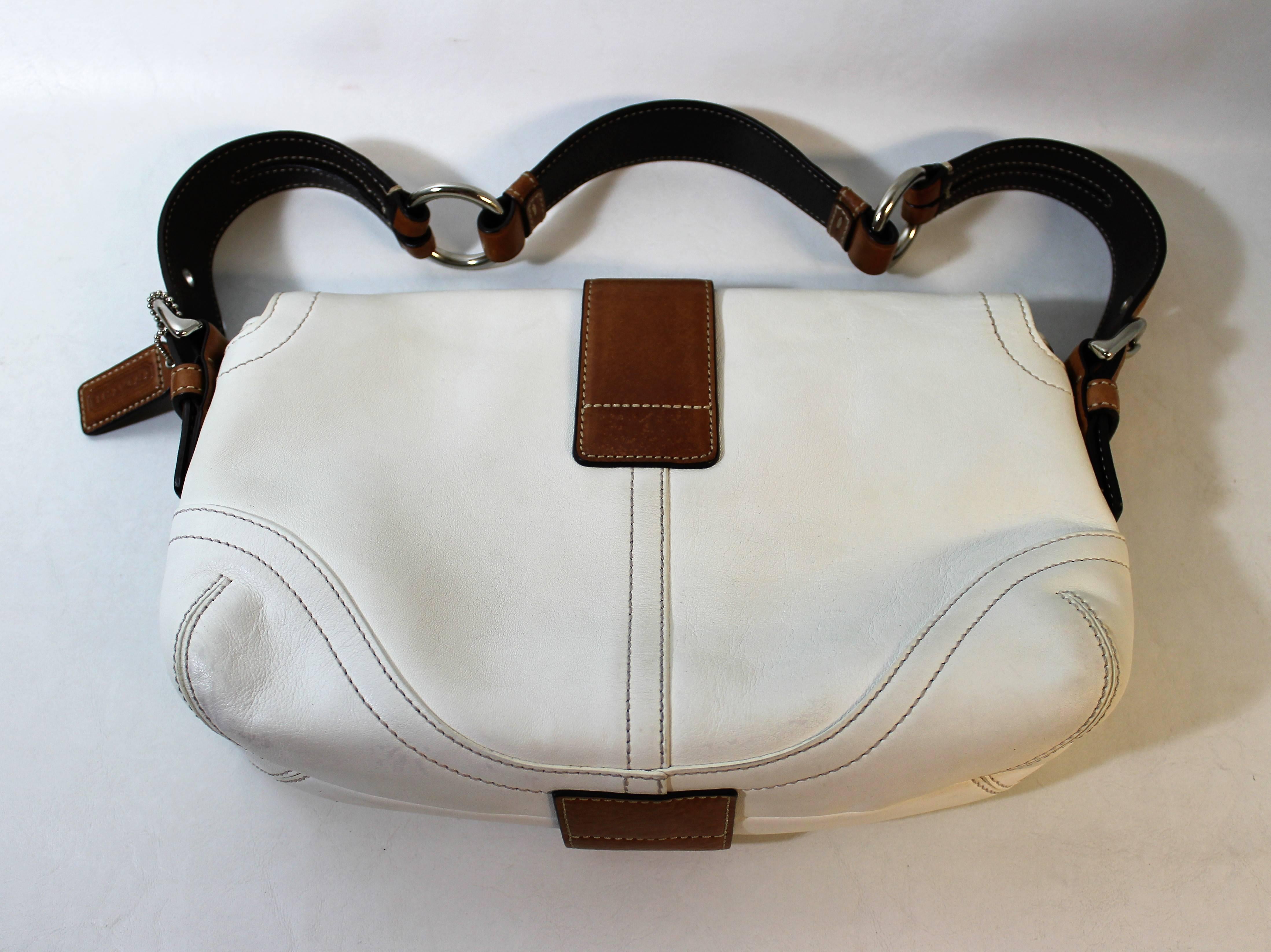 Leather coach handbag or purse.