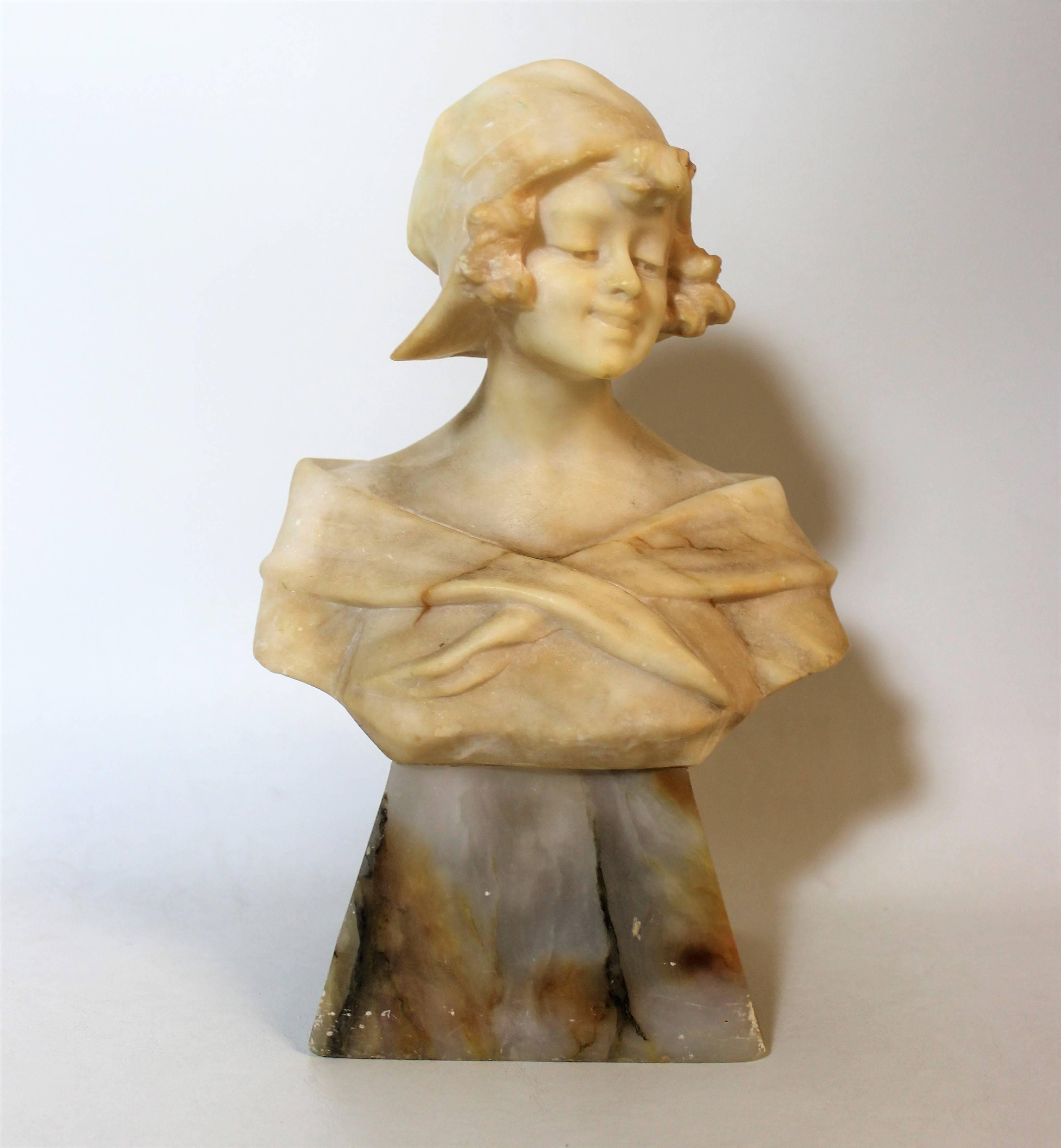 Beautiful alabaster sculpture of an Art Nouveau lady resting on a marble plinth. Signed R. Schoggi.