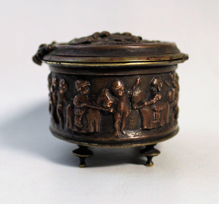 19th century bronze decorative or jewelry box with putti in relief.