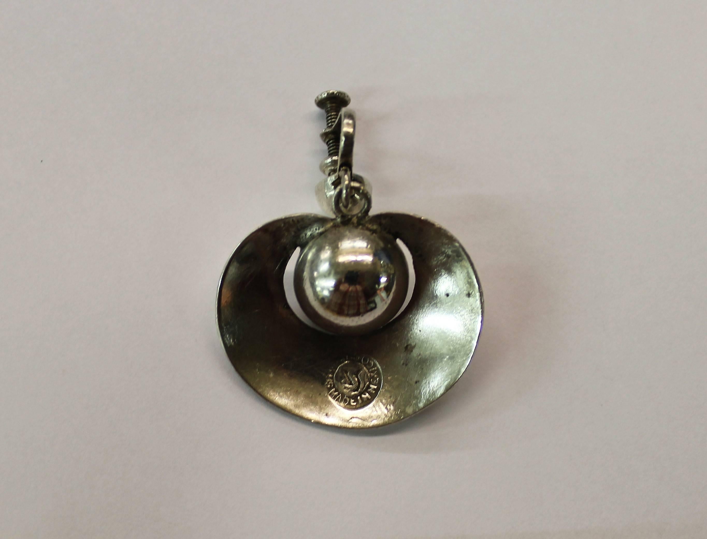 Pair of sterling silver earrings by William Spratling.