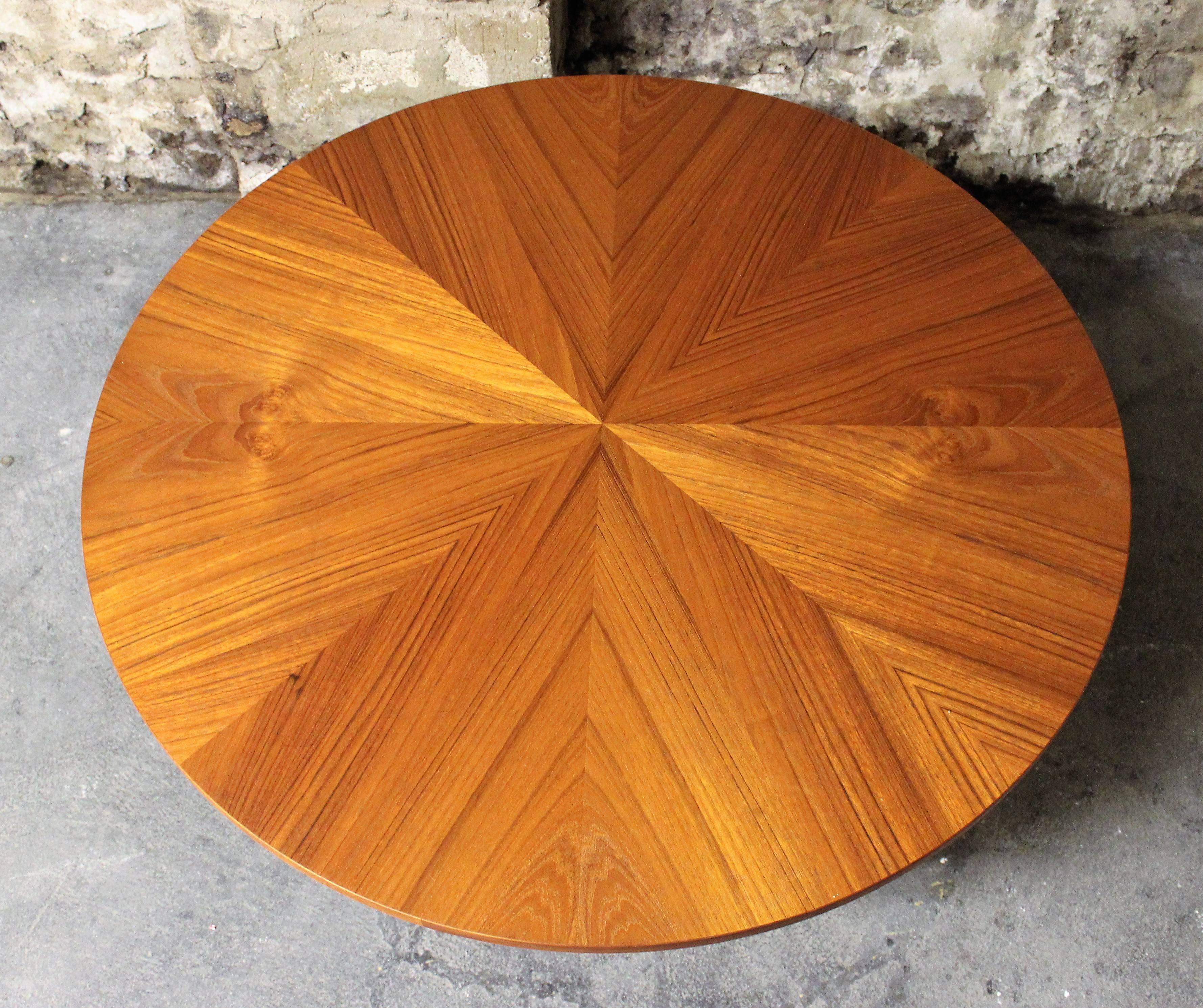 Truly stunning mid-century modern round teak coffee table. Designed by Danish designer Søren Georg Jensen and made by Kubus. Sculptural solid teak frame and teak top with amazing starburst design.

Scandinavian Modern / Mid-Century Modern
