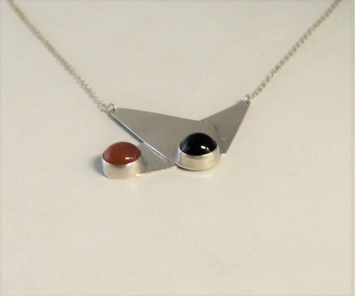 Tigga sterling silver modernist pendant necklace with carnelian and onyx.