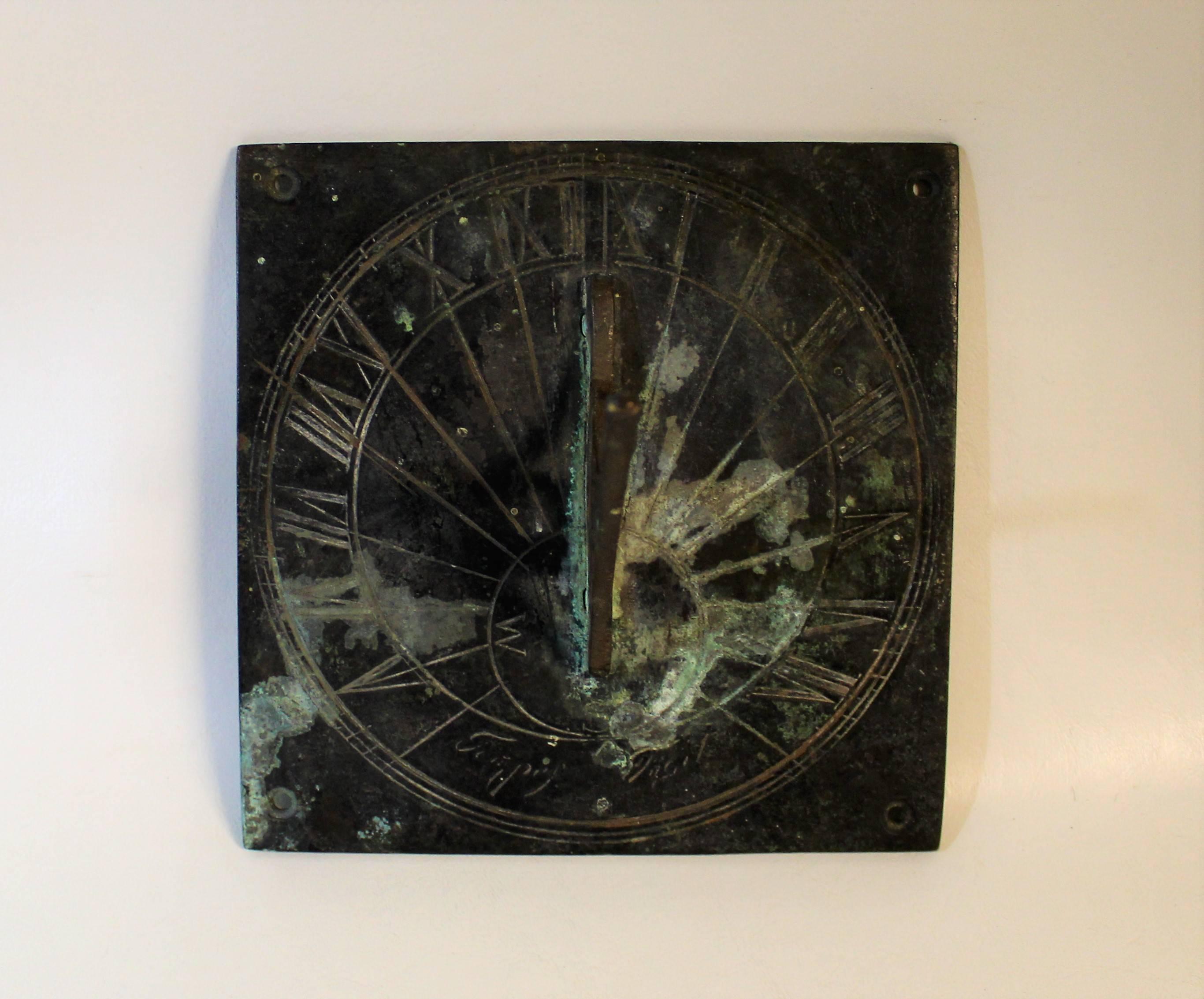 19th century bronze sundial with text and roman numerals and beautiful aged patina.