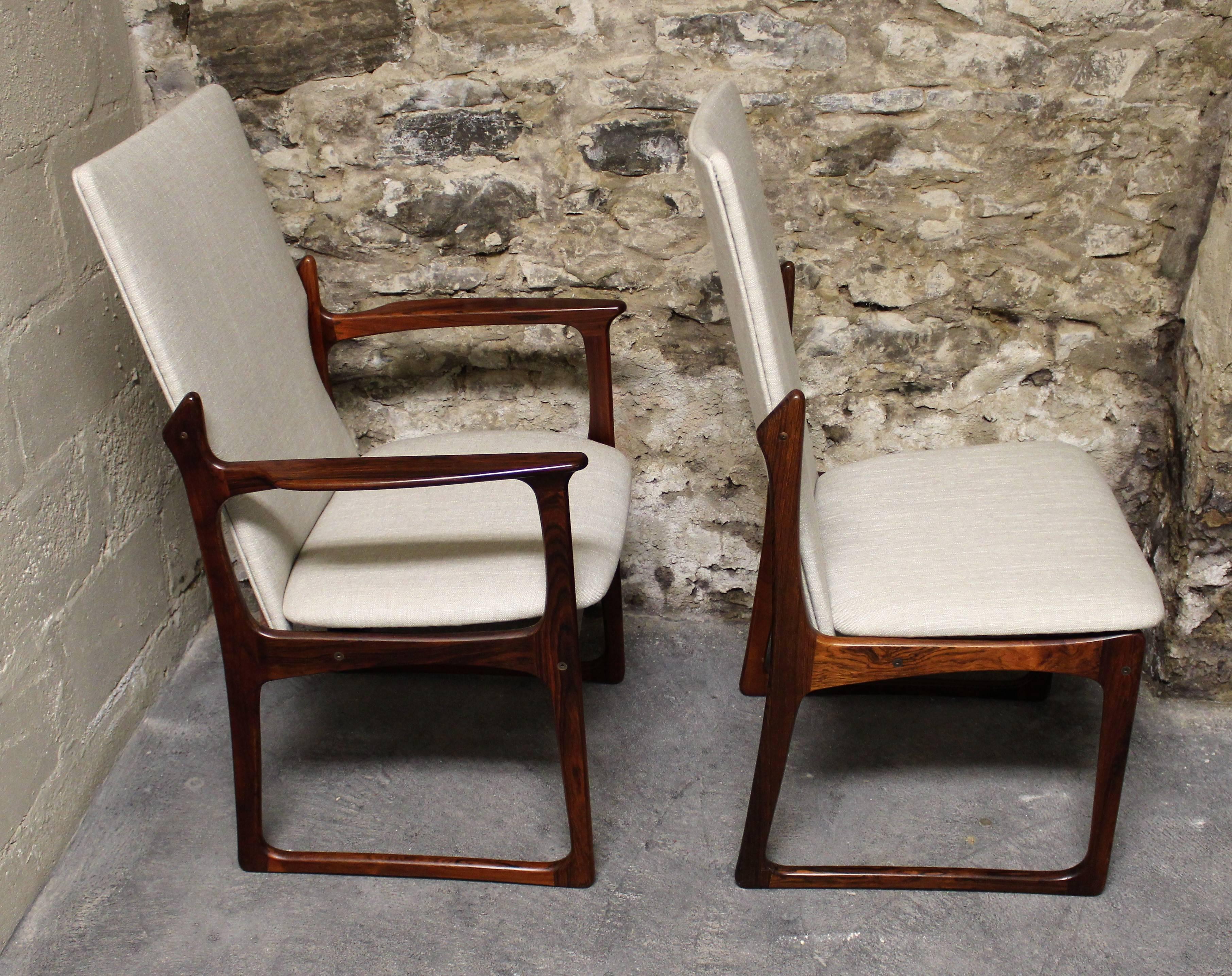 Beautiful set of six rosewood dining room chairs by Art Furn of Denmark. Two of them are armchairs and they have all been re-upholstered in a light grey fabric.

Scandinavian Modern / Mid-Century Modern.