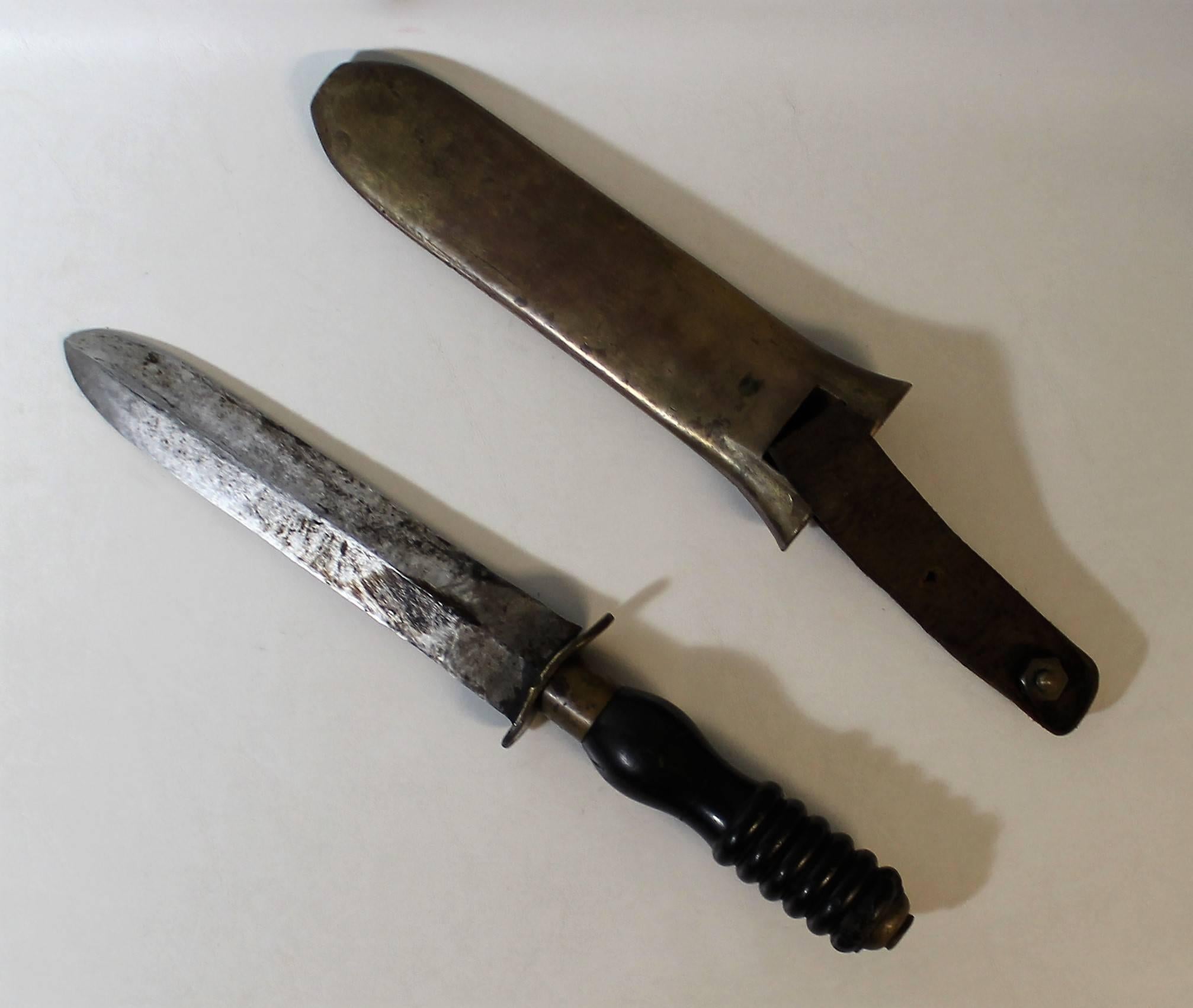 British made Siebe Gorman diving knife with brass scabbard, ebonite handle and leather strap made for the Dutch military. The * after the makers name etched in the blade indicates that this is a non magnetic knife.