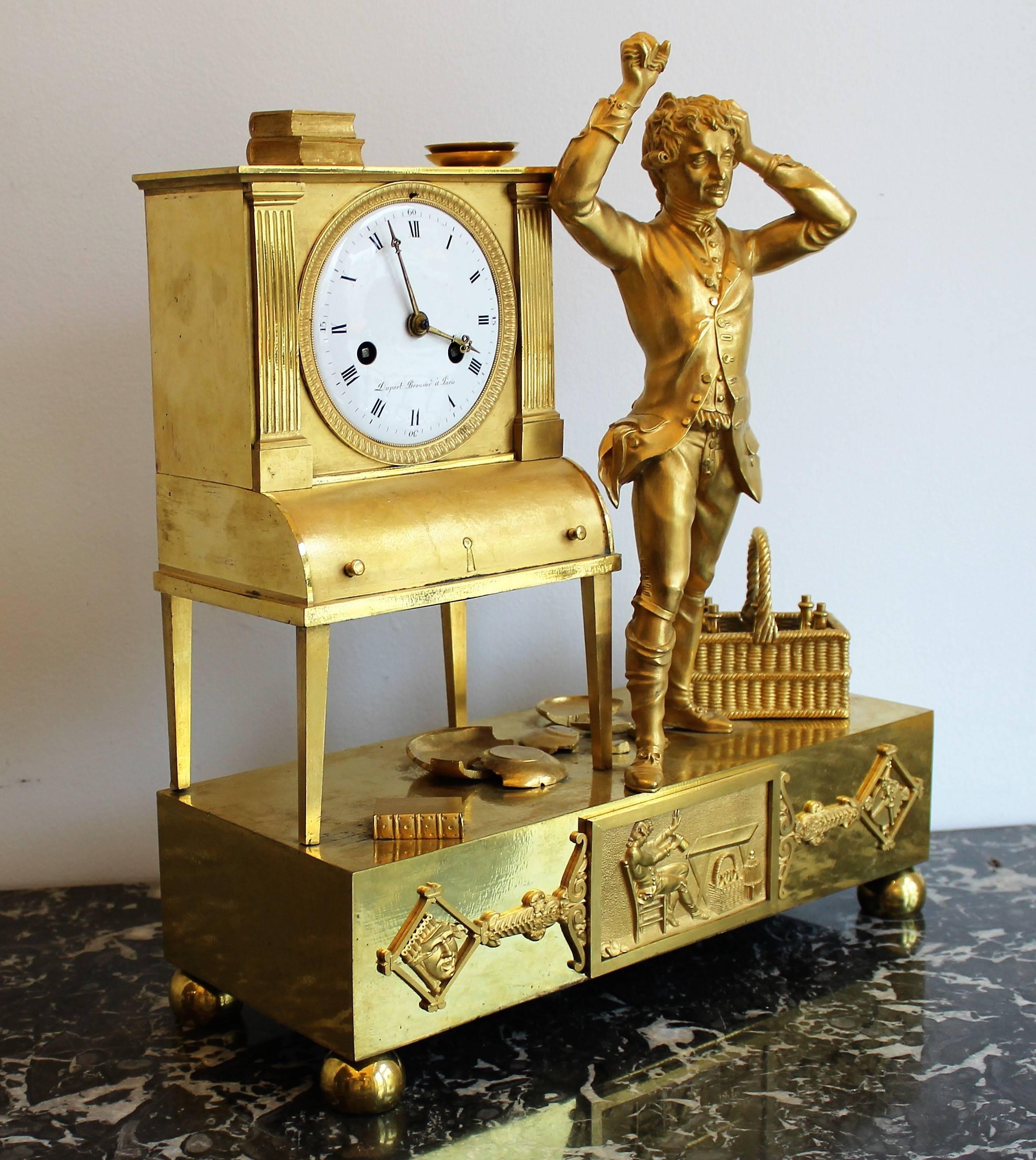 French bronze gilded Empire period allegorical clock of a drunken tragic figure.