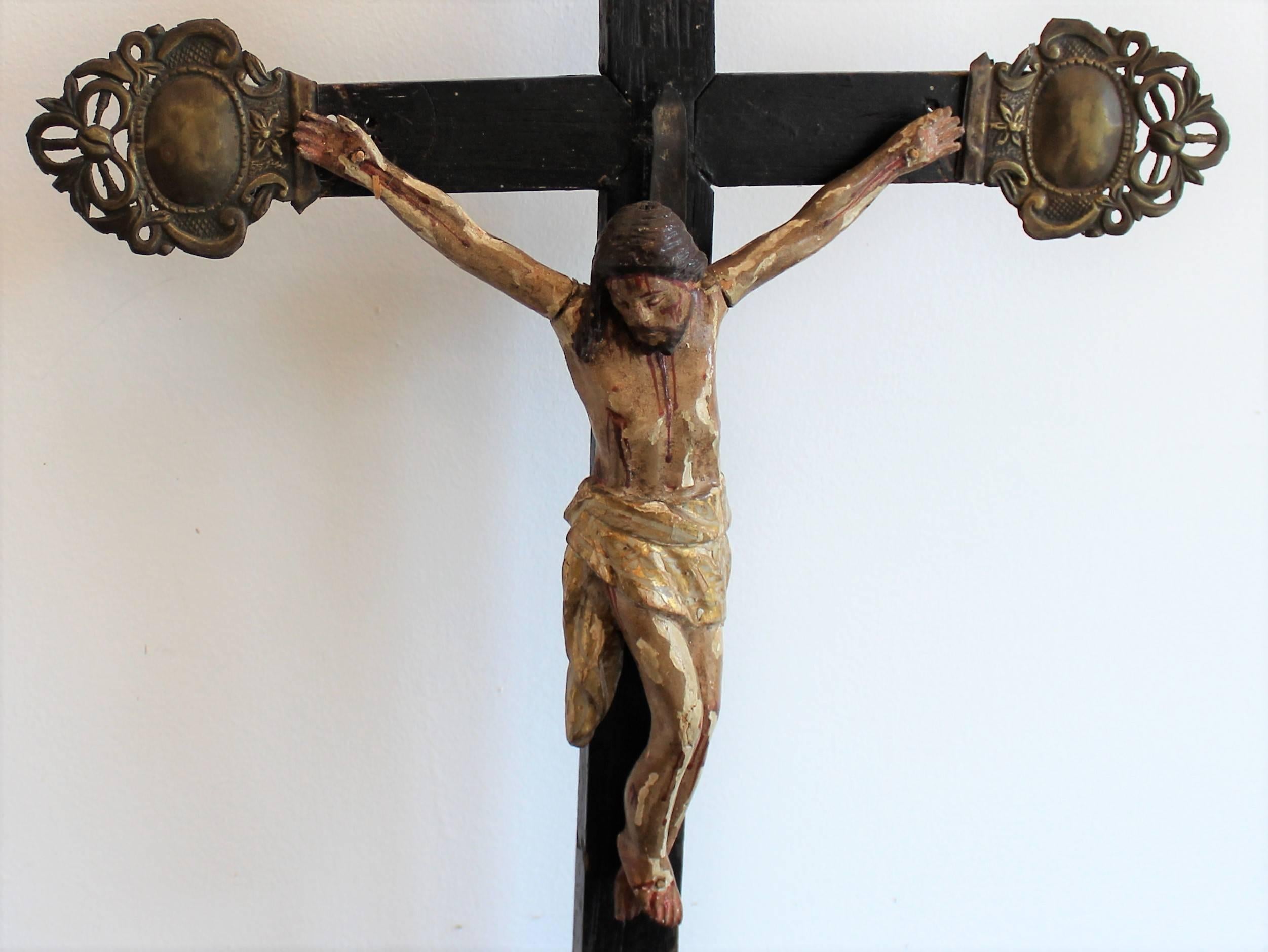 Early 19th century hand-carved and polychromed wood crucifix from Quebec.
