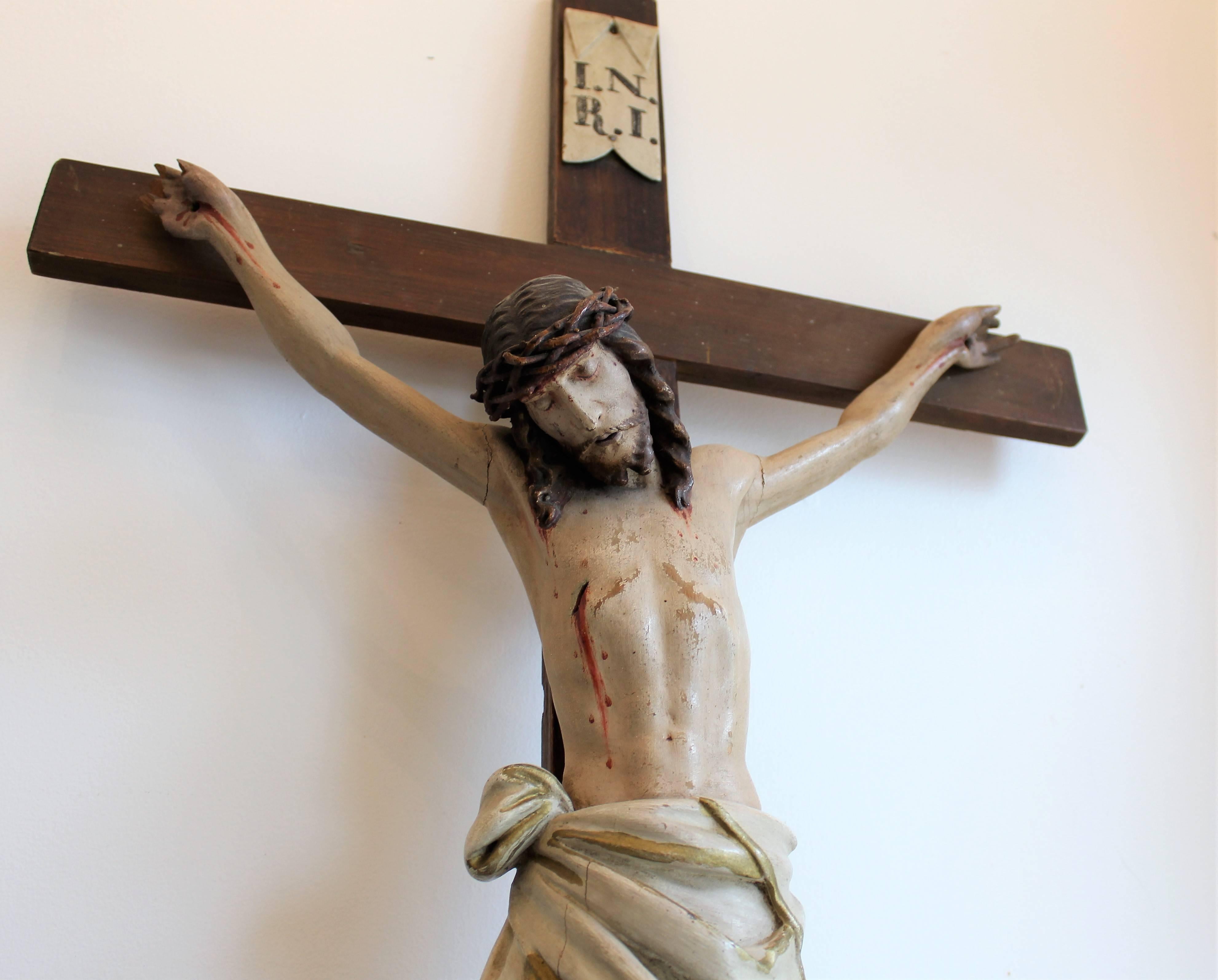 Early 19th century European hand-carved and polychromed wood crucifix.