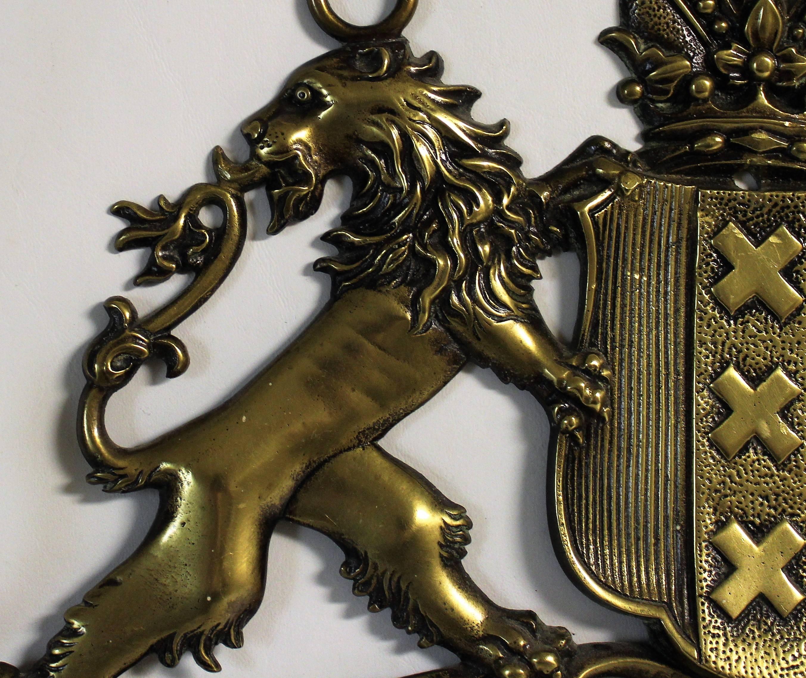 Early 20th century coat of arms brass coat hanger.