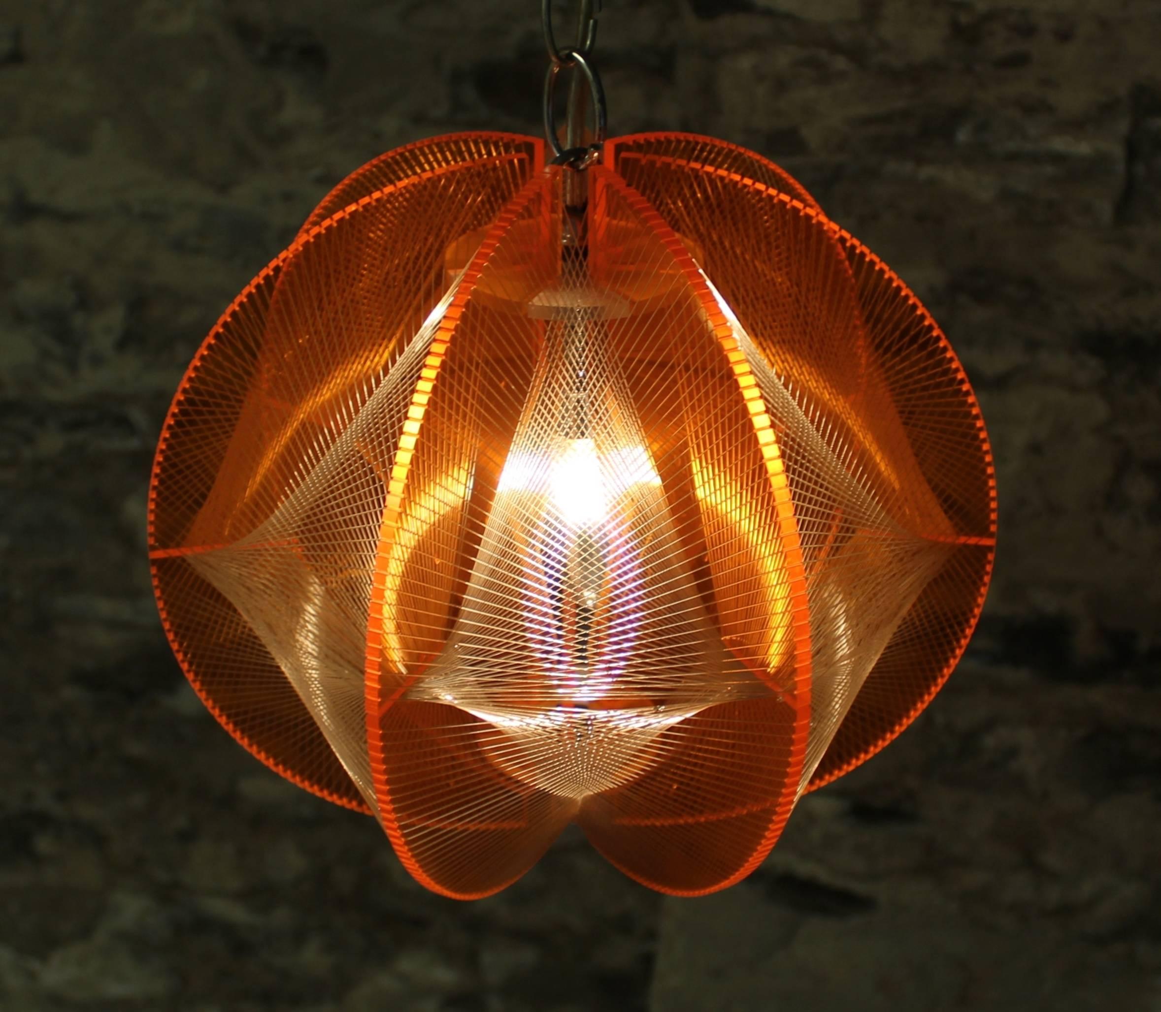 Mid-Century Modern Lucite geometric string light fixture or pendant.

Free shipping within the United States and Canada.