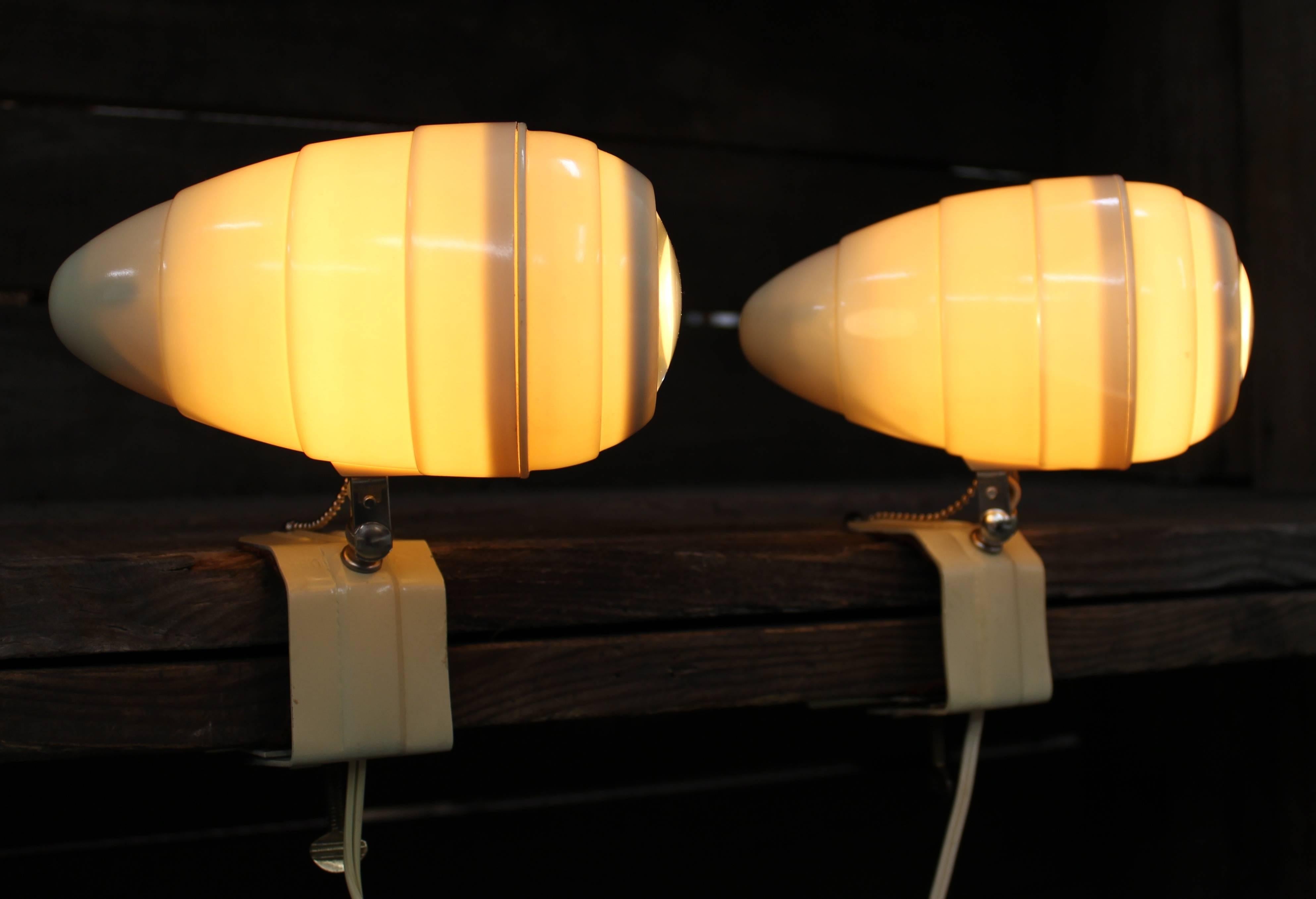 Pair of beehive clamp-on Mid-Century Modern lamps for bed or desk.

Mid-Century Modern clamp-on swivel lamps. Adjustable retro lighting which are great for bed posts, desks, or other places. Beehive and cone shaped with fish eye lenses. They have