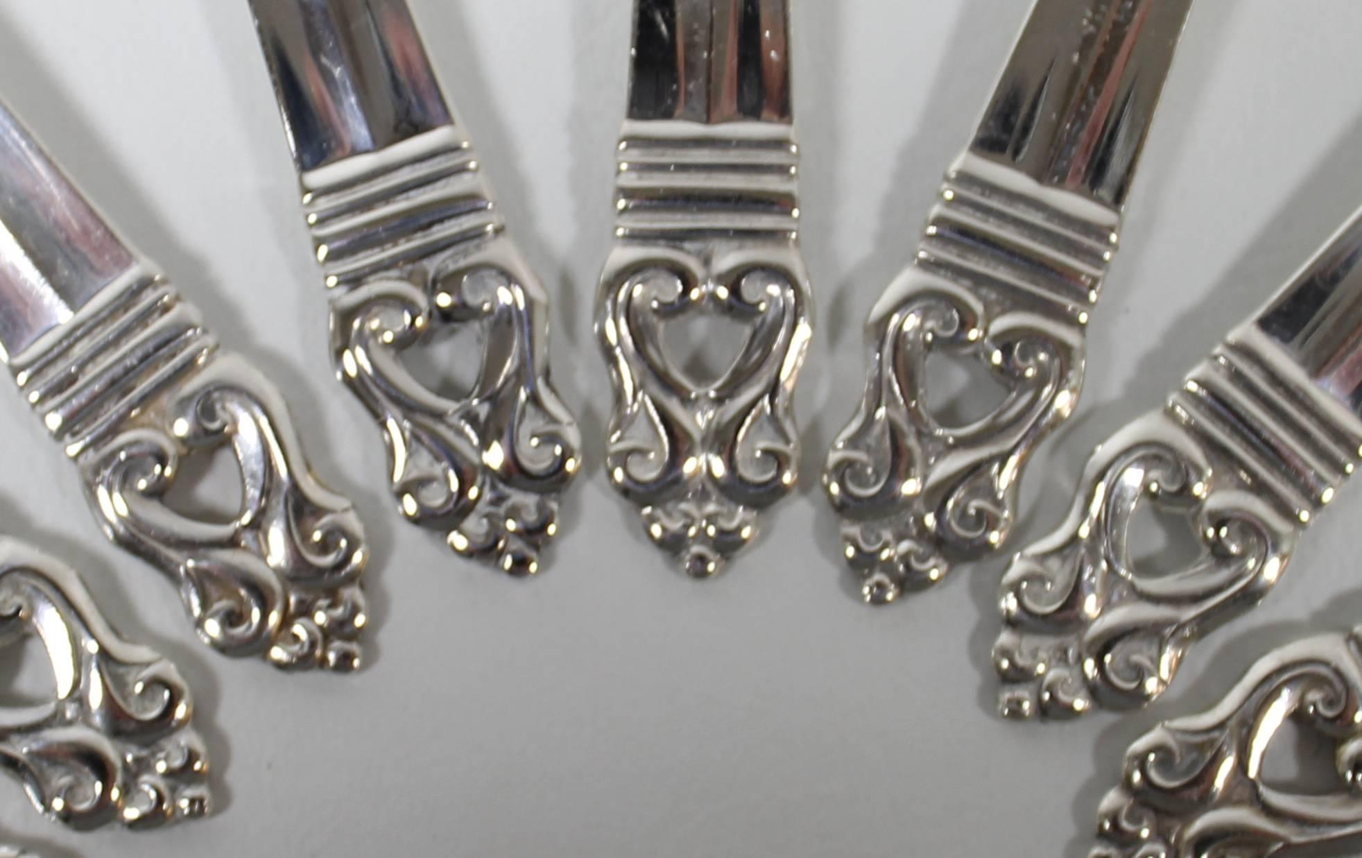 'Royal Danish' sterling silver spoons by Alfred G. Kintz for International.

Seven teaspoons and eight demitasse sterling silver spoons by American Silver designer Alfred G. Kintz. The pattern is 'Royal Danish