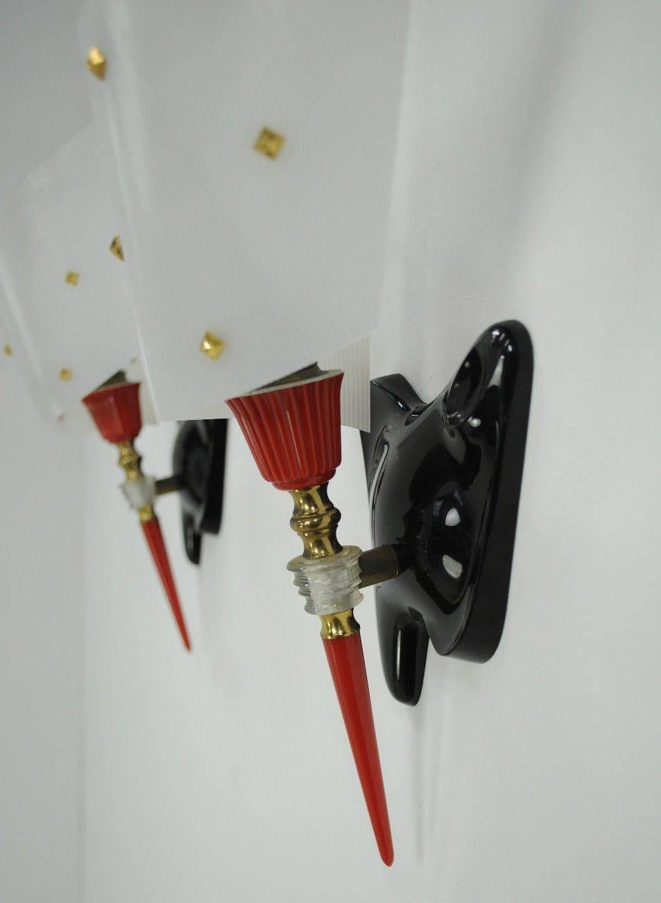 Pair of Mid-Century Modern French wall sconces.