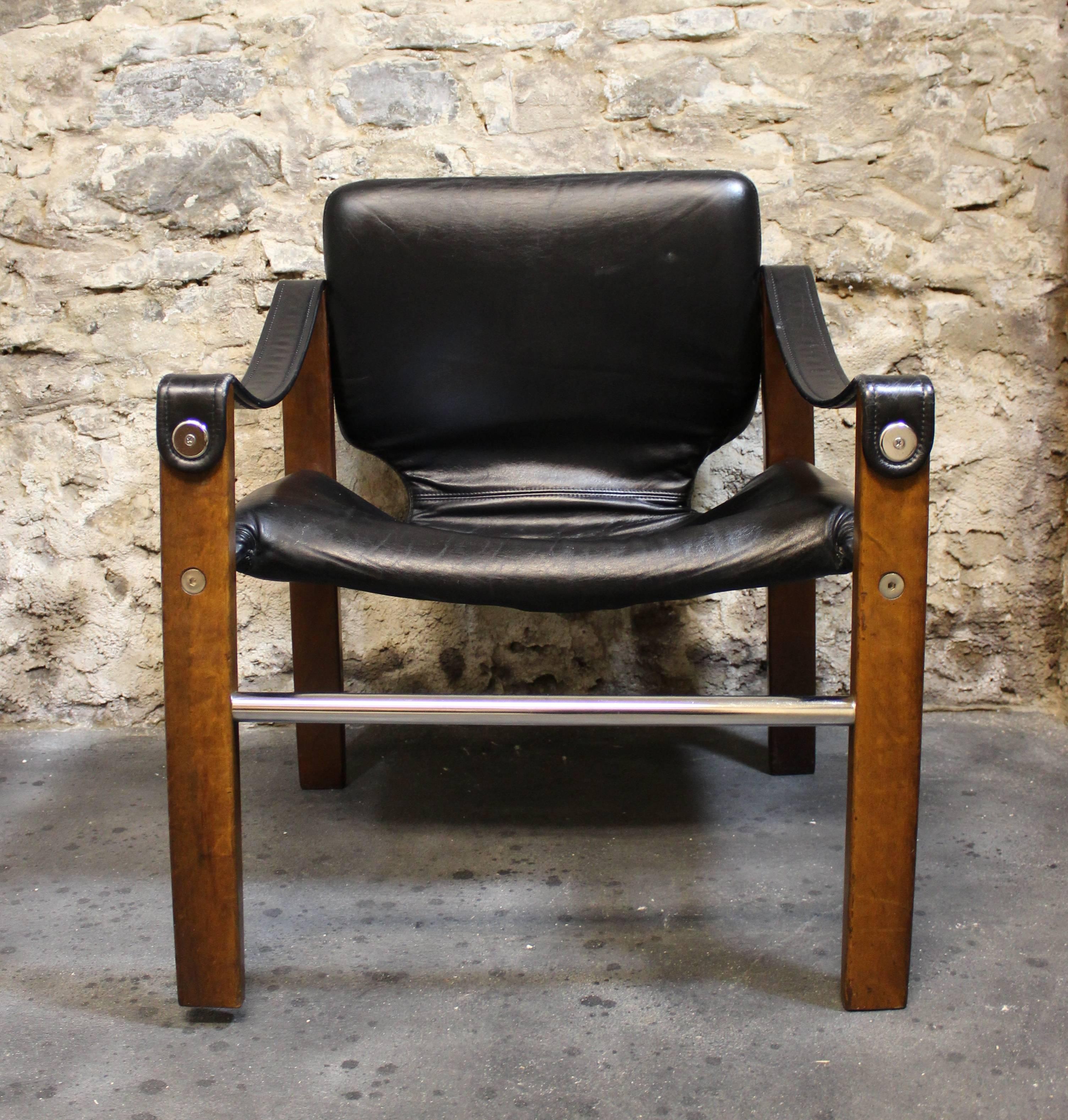 Safari chair by Maurice Burke.

Done in black leather upholstery.