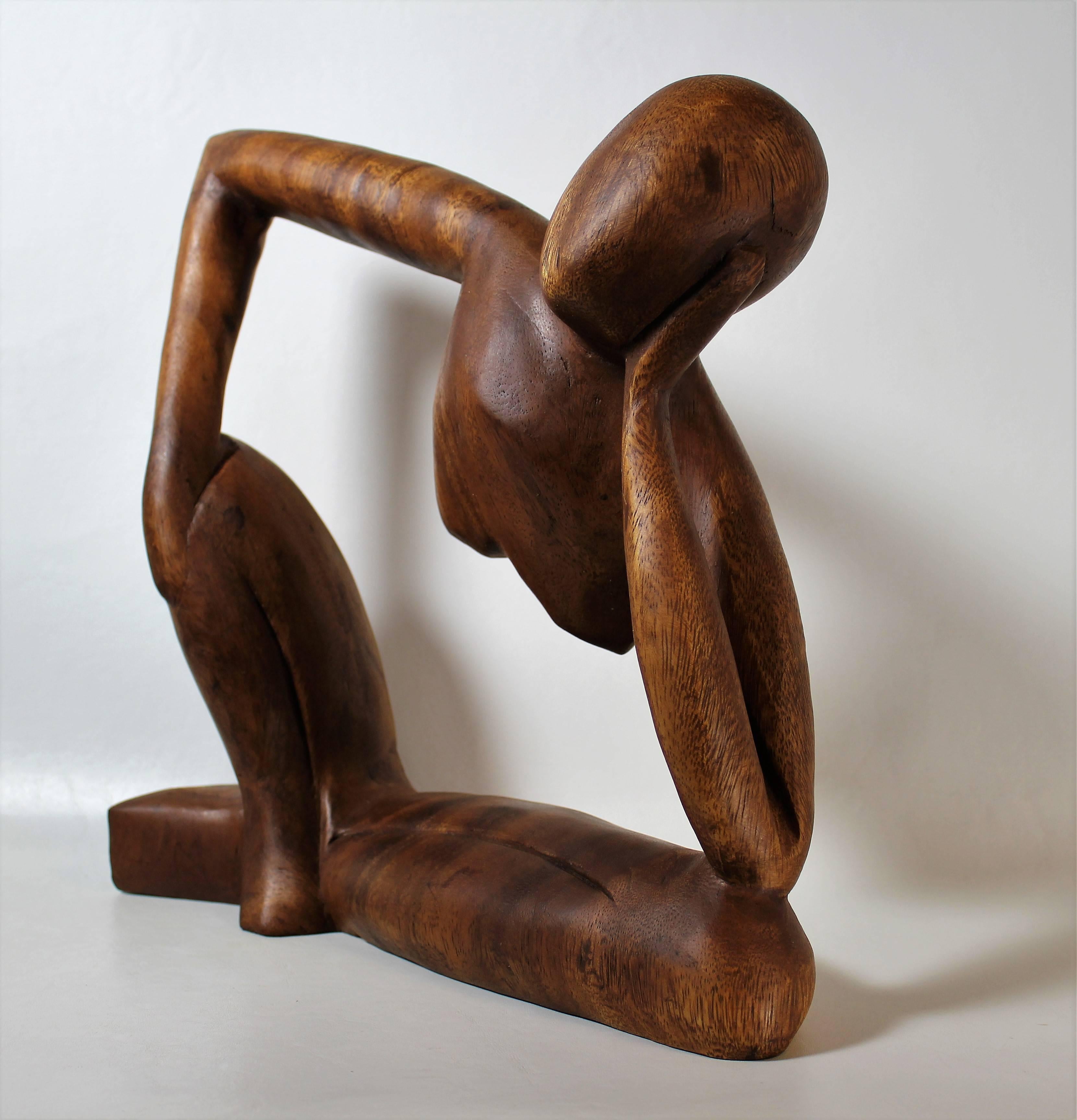 Mid-Century Modern teak figurative sculpture.