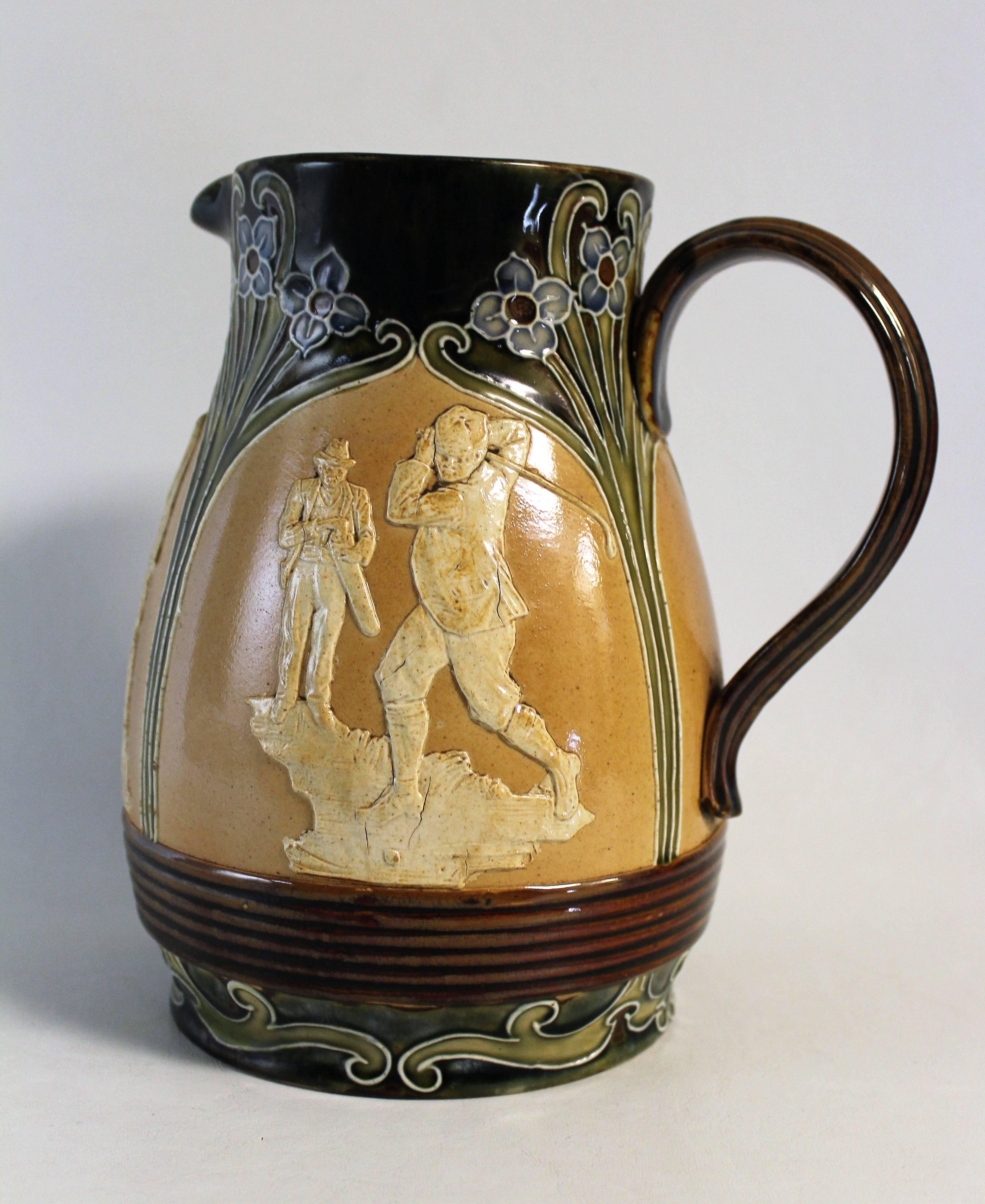 An Art Nouveau stoneware bulbous pitcher with stylised foliate decoration and three golfer scenes featured in relief: Lost ball, putting and the drive amongst Art Nouveau panels.