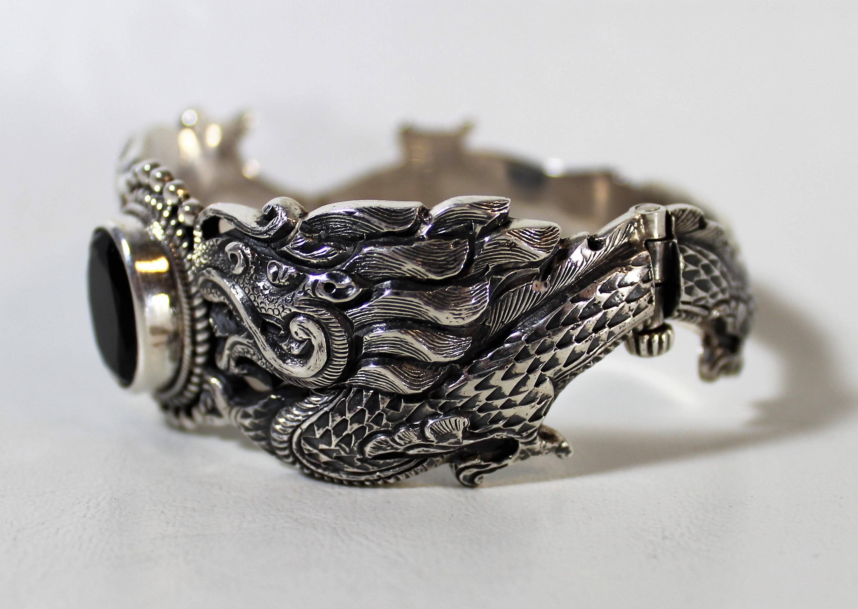Nepalese sterling silver and onyx dragon bracelet. Weight: 90 grams.