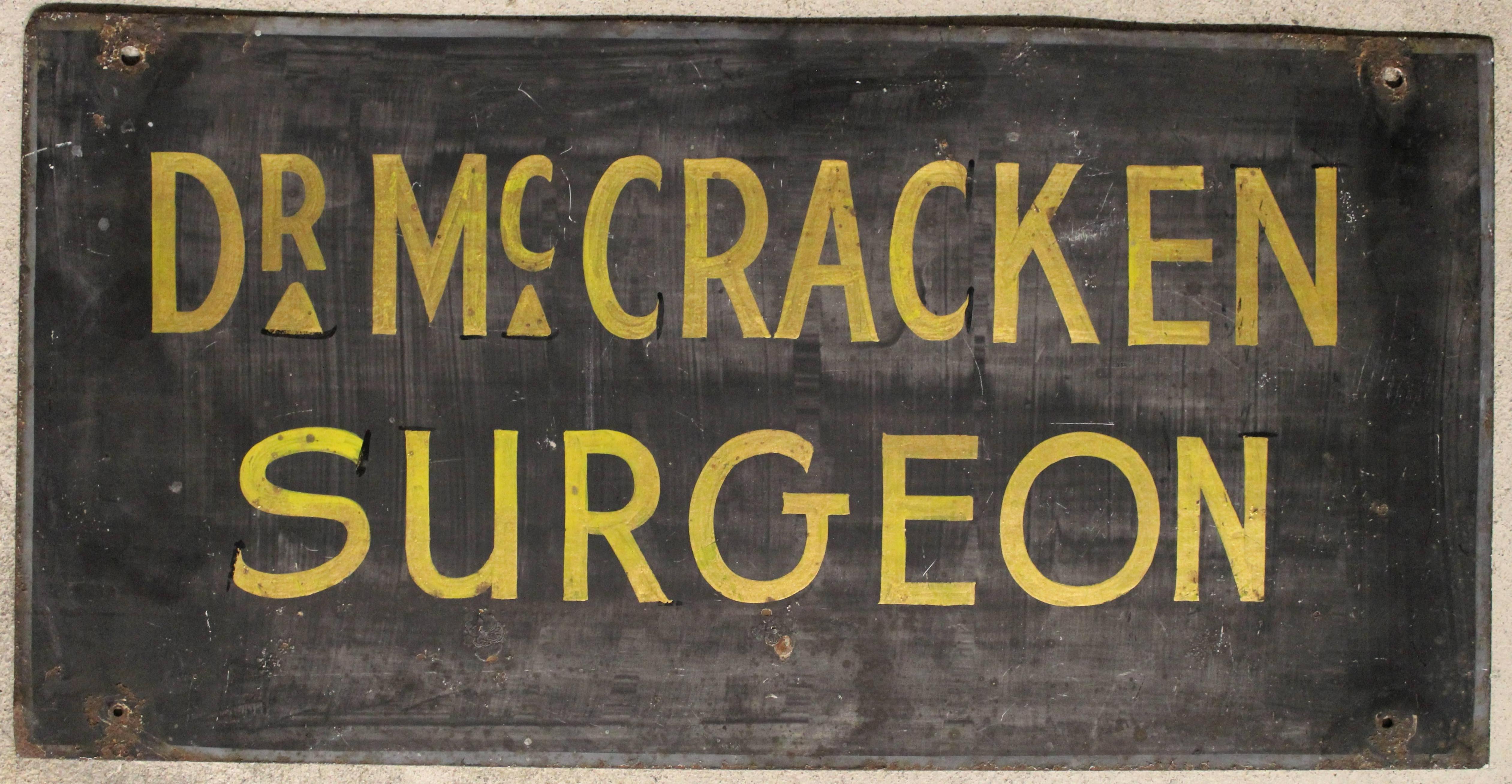 Double-sided doctor's medical practice trade sign for 'Dr. McCracken'.