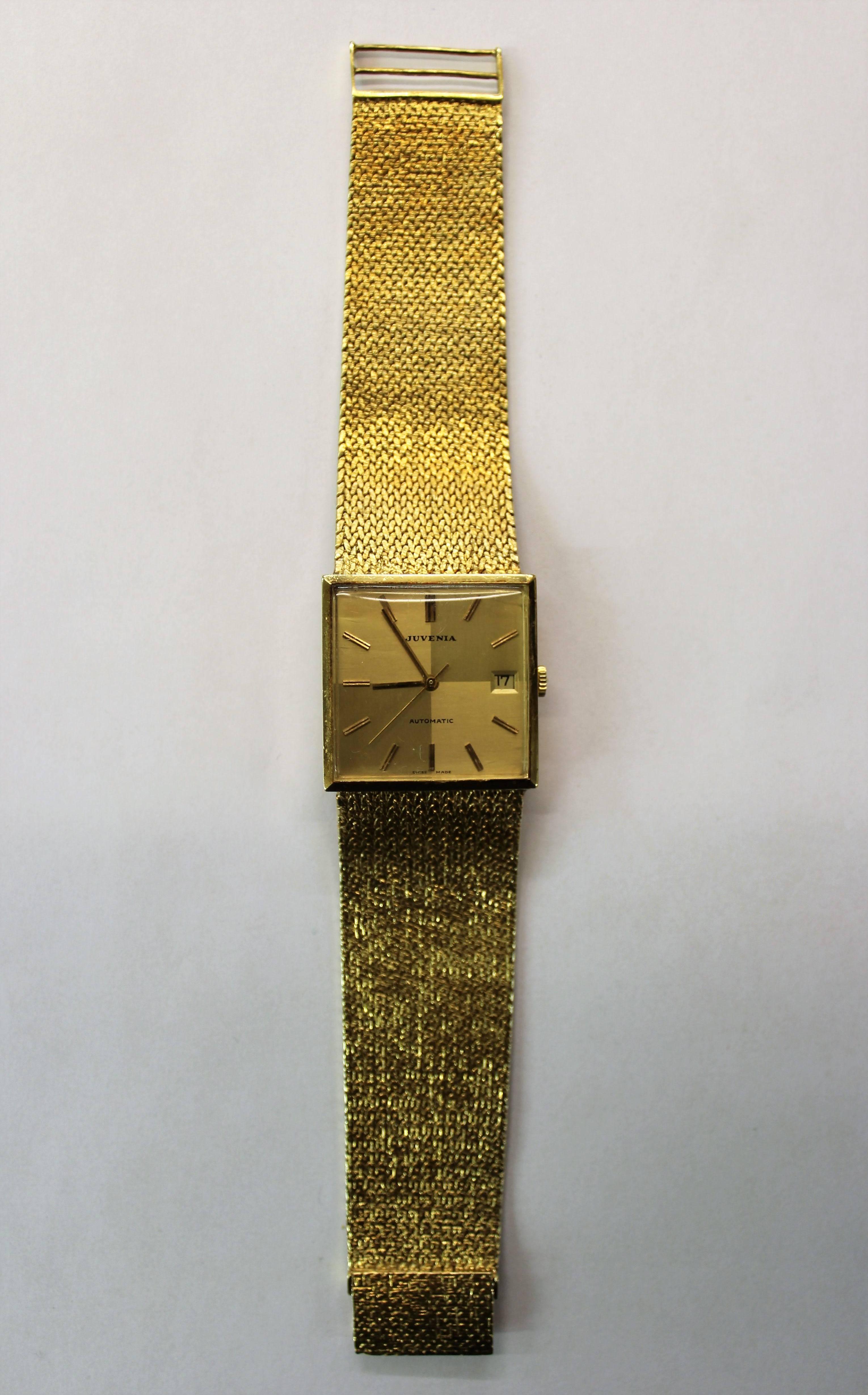 Juvenia solid 18-Karat yellow gold automatic Swiss made watch. The watch weighs 92.4 grams and is in good working order. This is a beautiful example of a luxury swiss made watch.