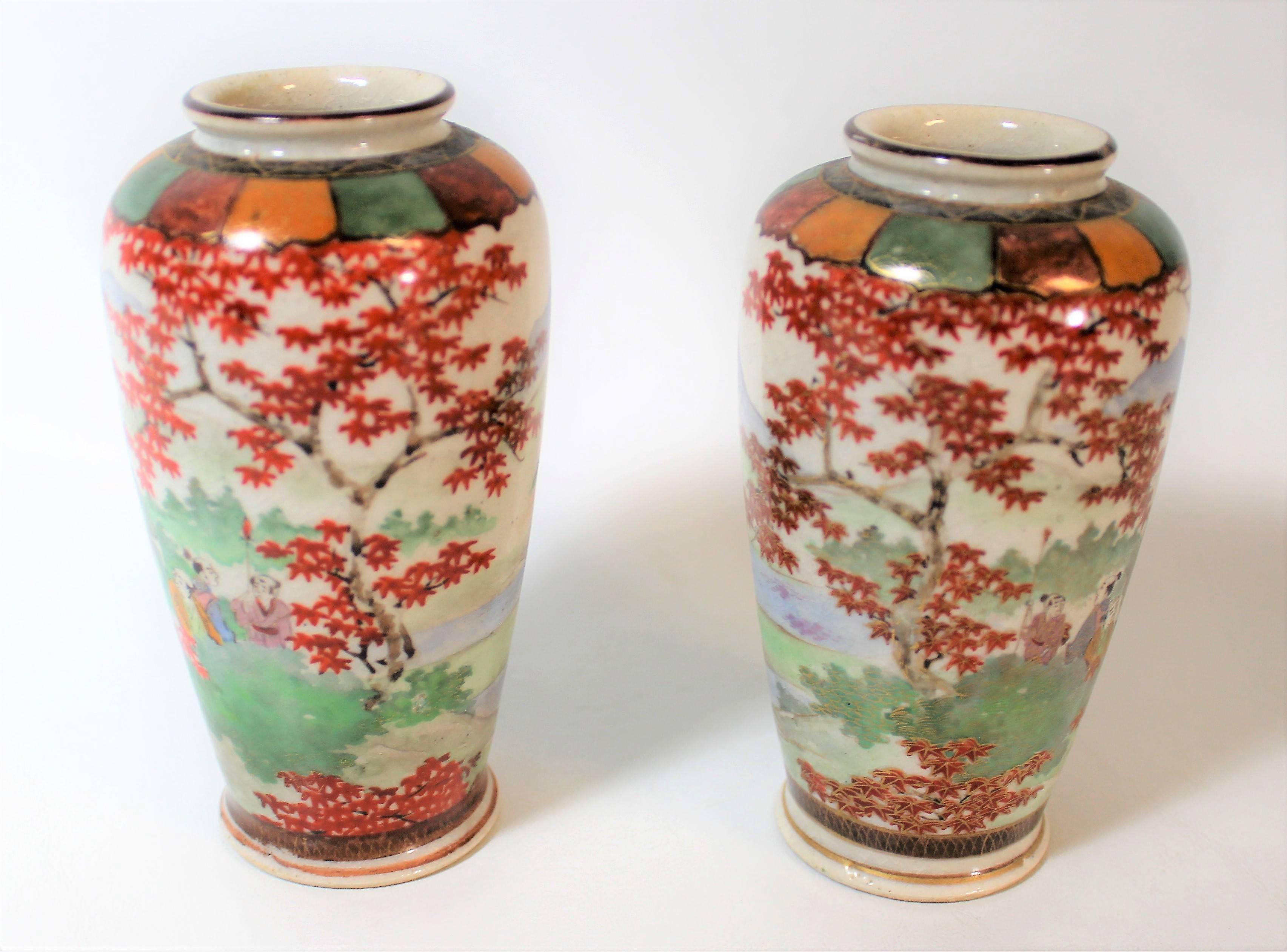 Pair of Japanese Meiji period hand-painted porcelain vases.