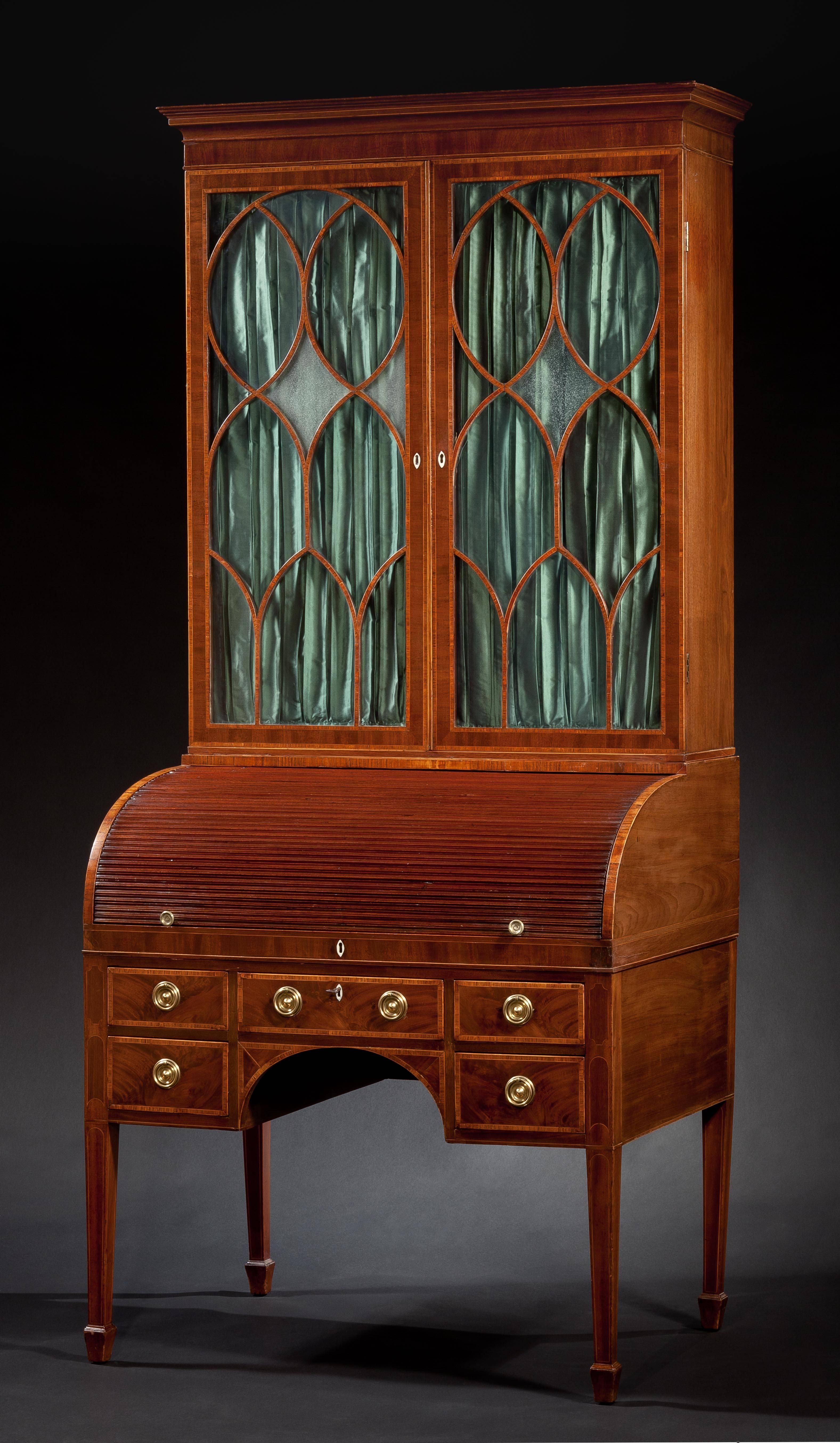 IMPORTANT FEDERAL INLAID MAHOGANY 
TAMBOUR CYLINDAR SECRETARY BOOKCASE
Attributed to John Aitken (1770-1814)
Philadelphia, c.1798
In two parts: the upper case with projecting cornice above a veneered frieze above a pair of glazed cabinet doors