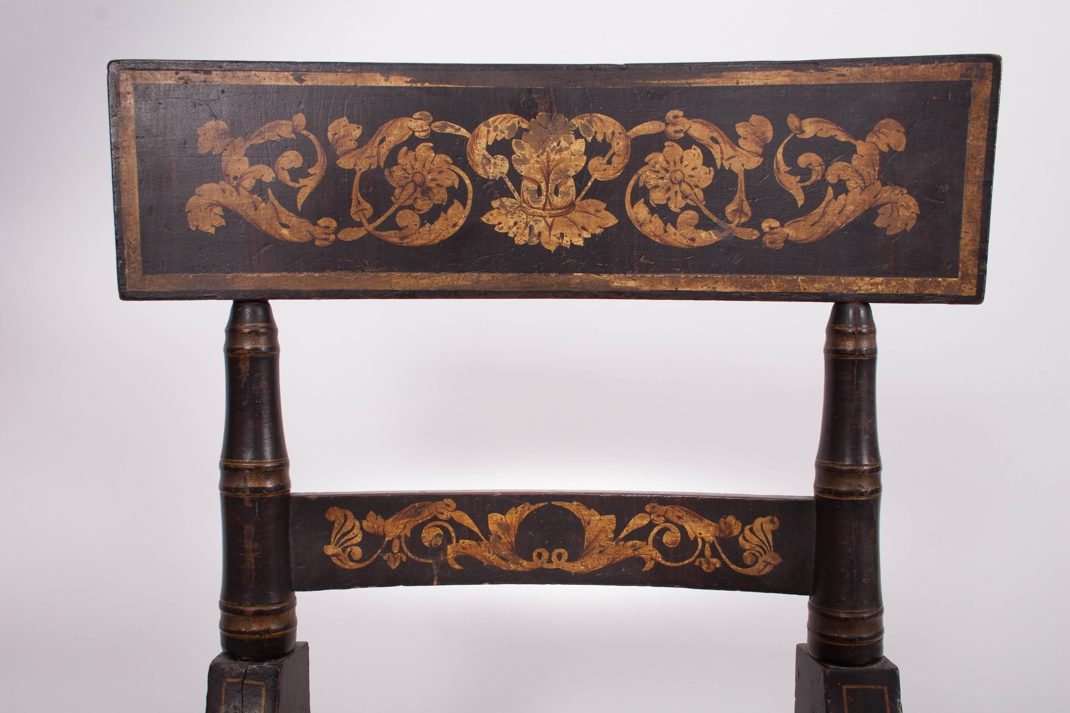 Baltimore, 1820-1830.

With faux-rosewood graining and gilt stencil decoration, the shaped crest rails held by turned stiles, a stay rail above a rush seat withy turned front and rear legs connected by stretchers.

Related chairs are in the