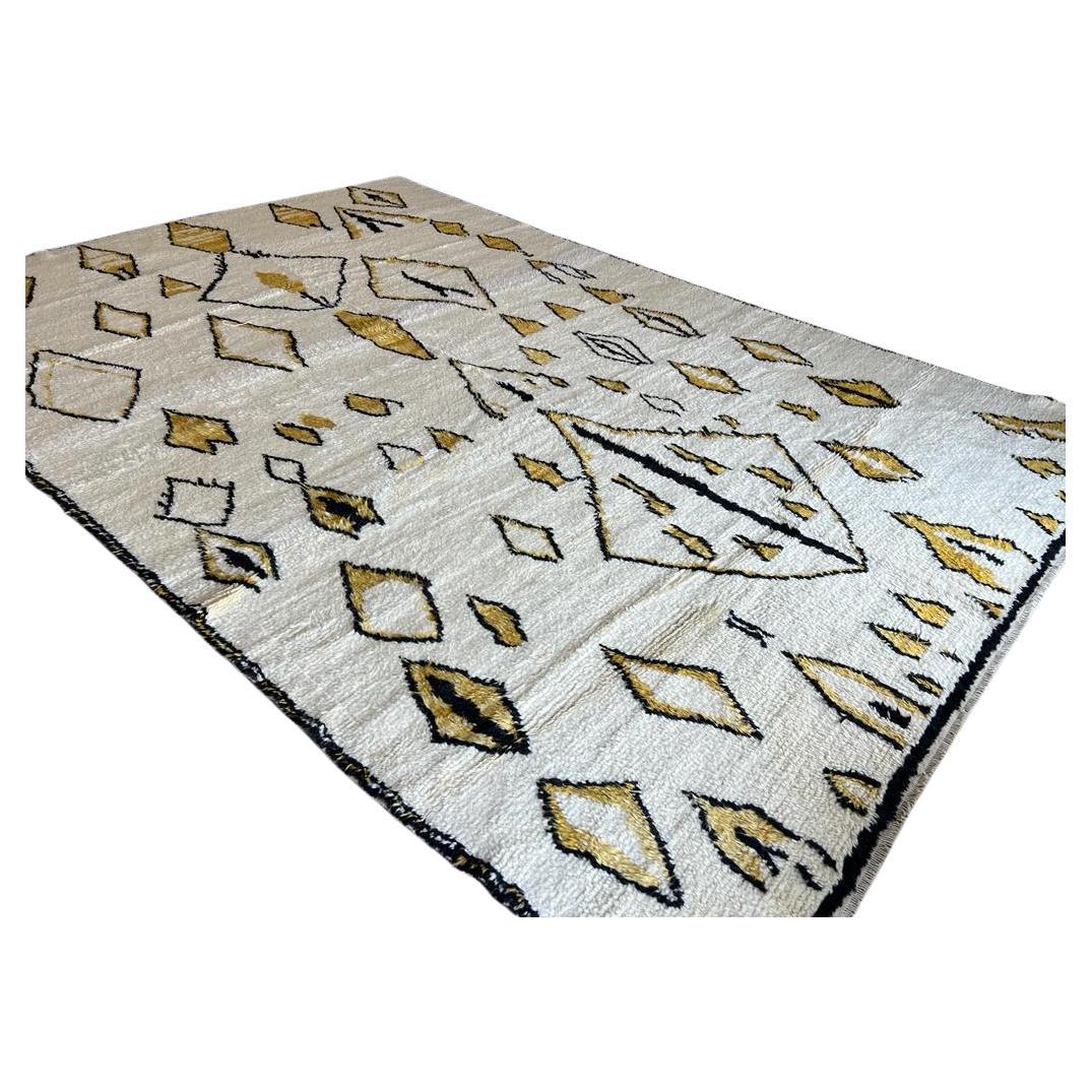 This 10x14 ft hand-knotted Moroccan-style rug is a contemporary piece inspired by the timeless Berber weaving traditions of North Africa. Handmade by our master weavers in Turkey, it is crafted entirely from 100% wool on a wool foundation, ensuring